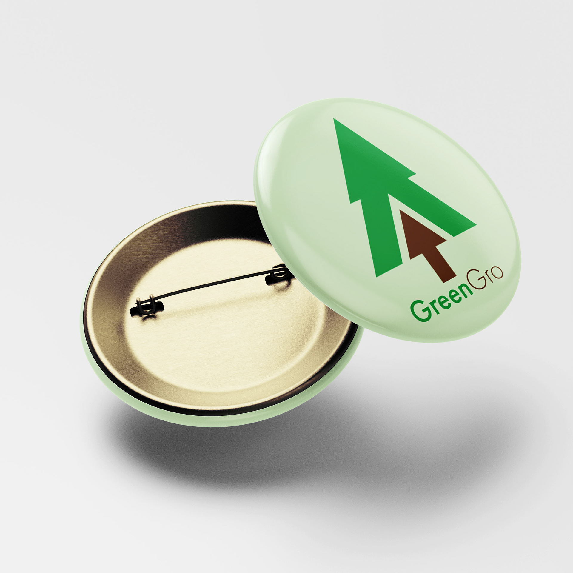 This is a button featuring the GreenGro logo and logotype combination.
