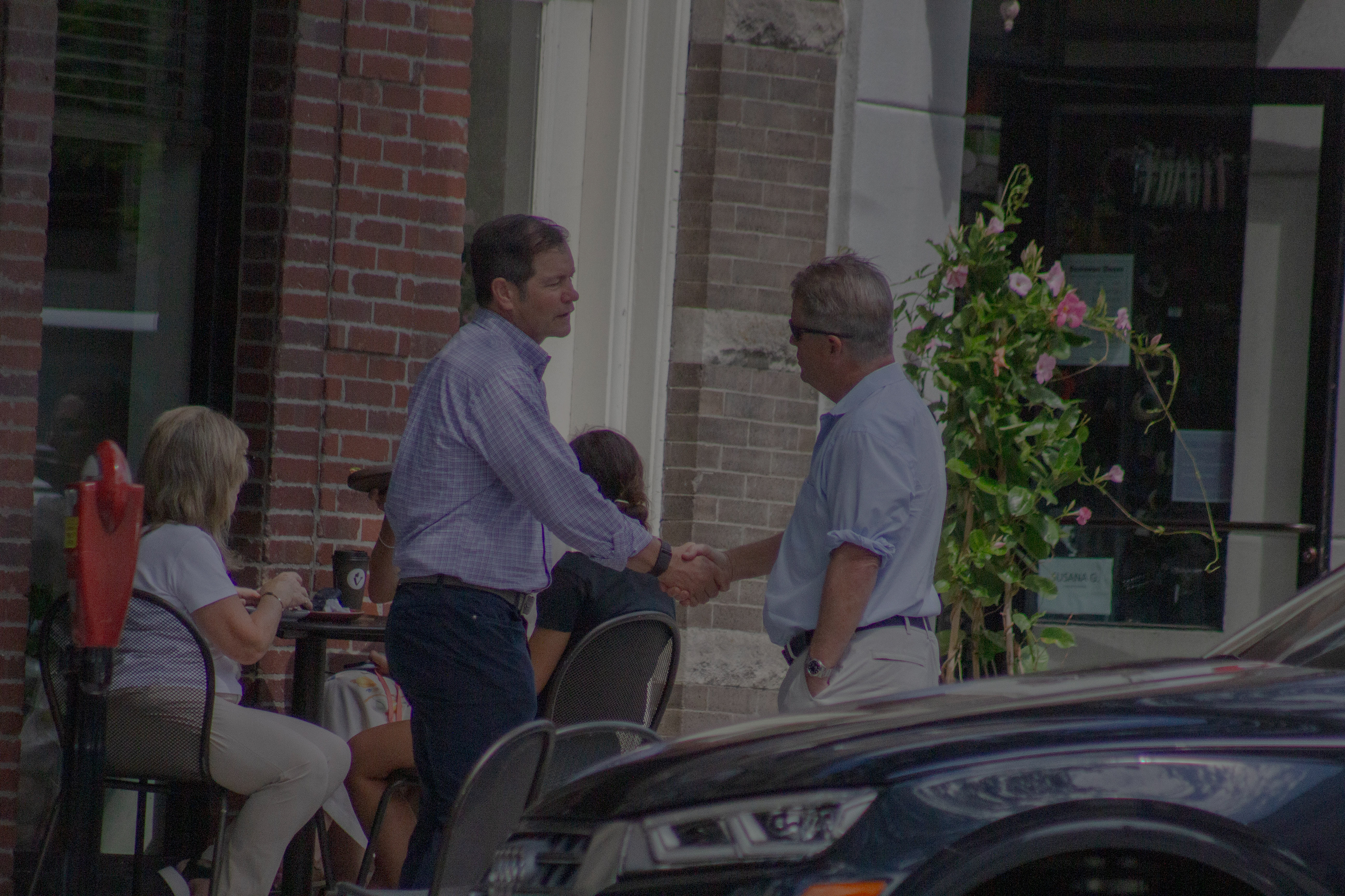 A very firm, business handshake. 