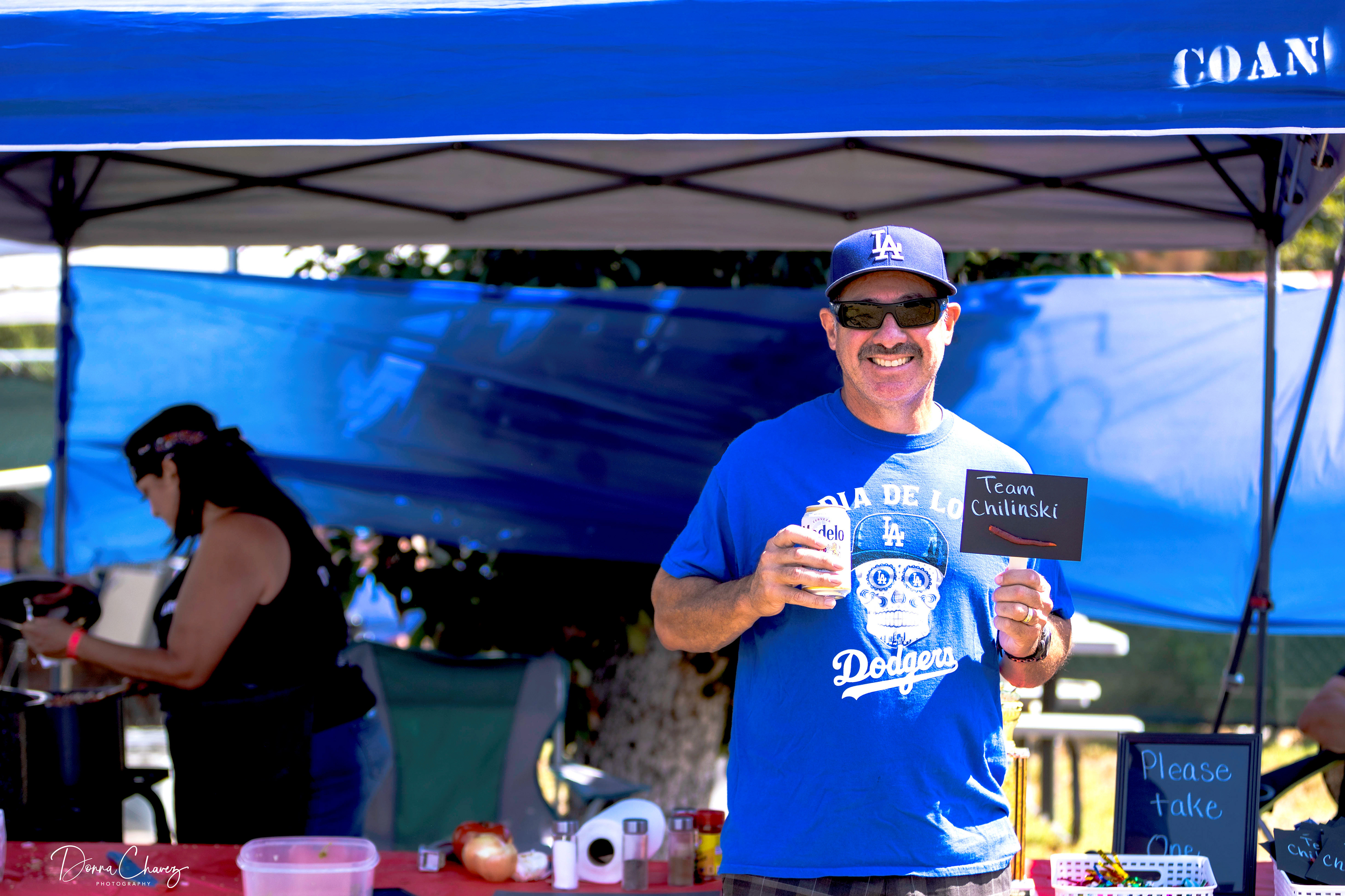 Edward Chavez enjoys a cold beverage and cheers his team on, "Go Team Chilinski!"