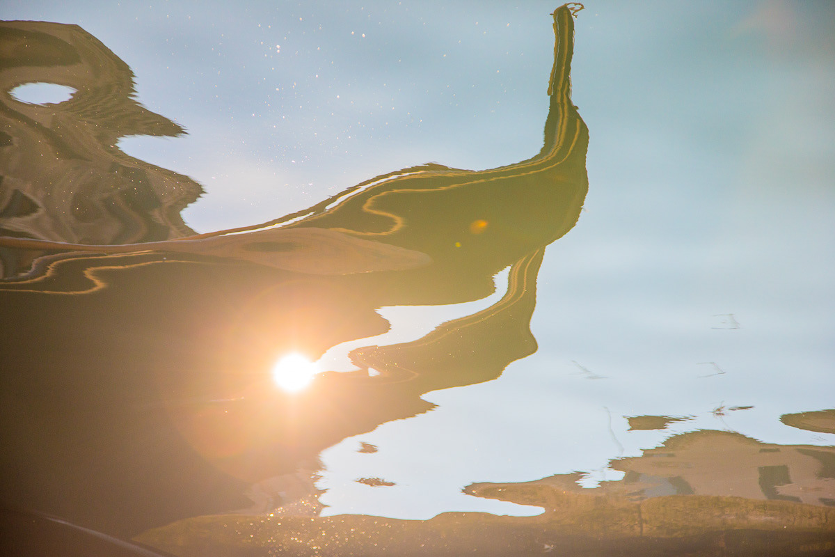 Reflections - dance of light - Venice - gondolas against sun