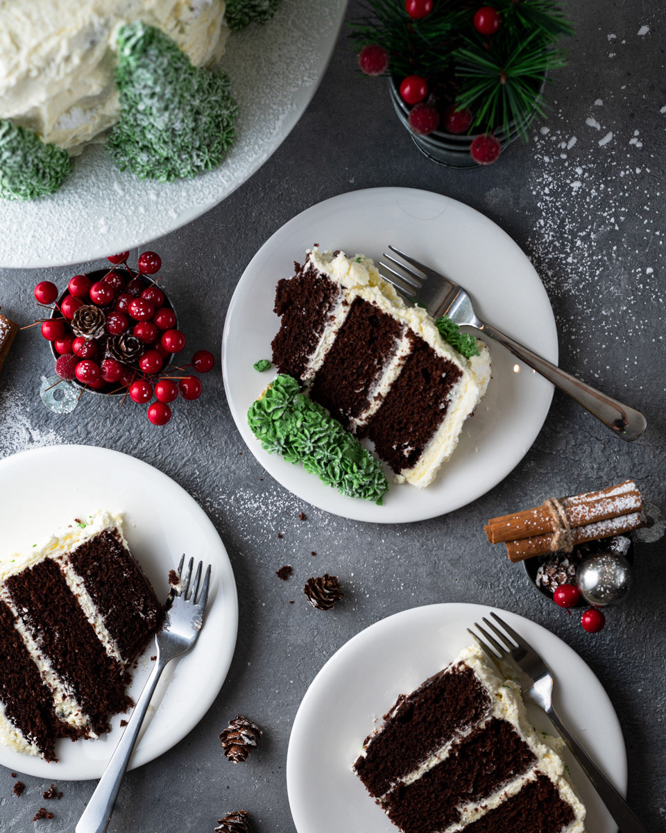 Three slices of Christma cake on small plated taken by Anusha Stewart