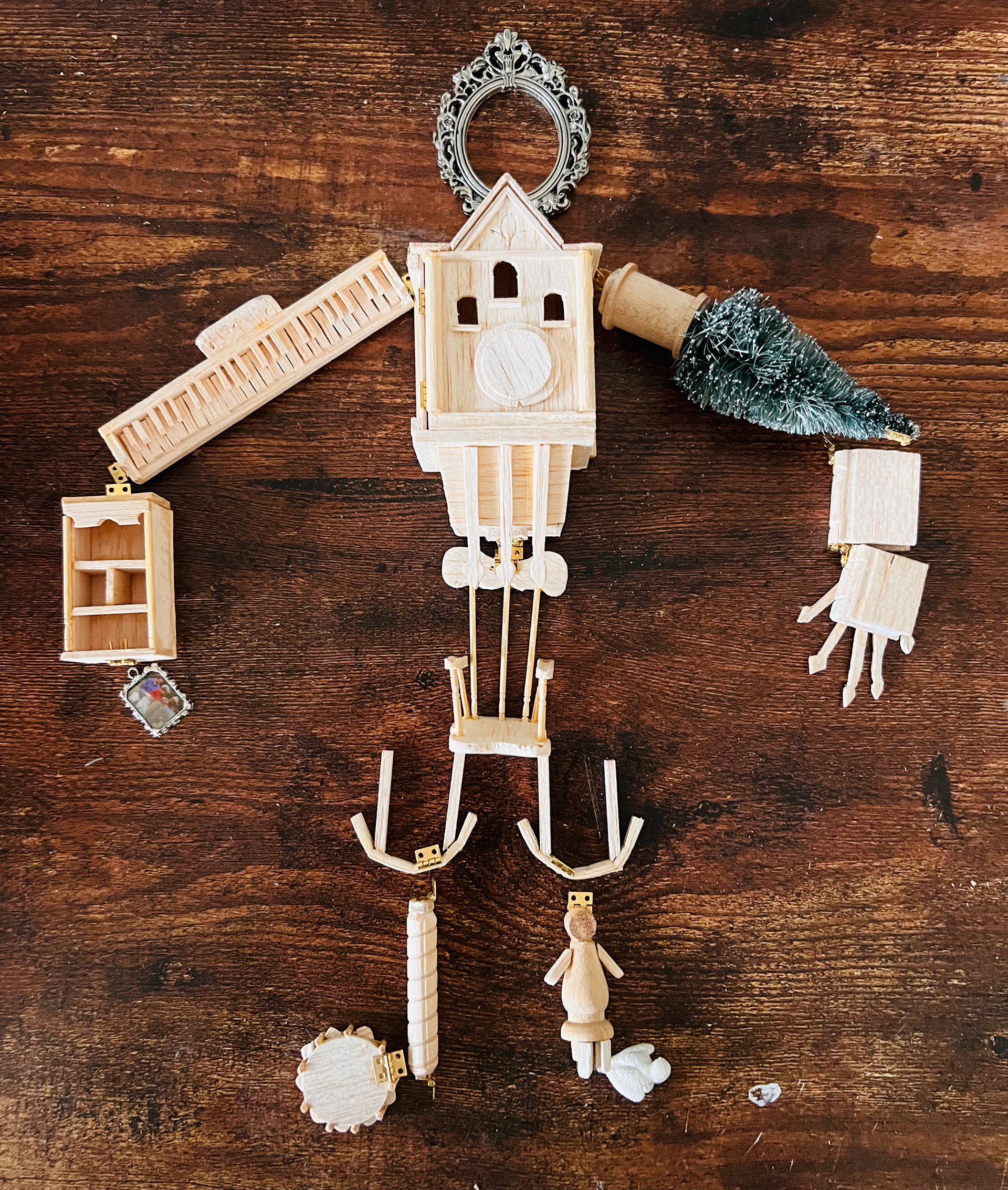 Lay out of my hand-carved and cut miniatures that make up his body.