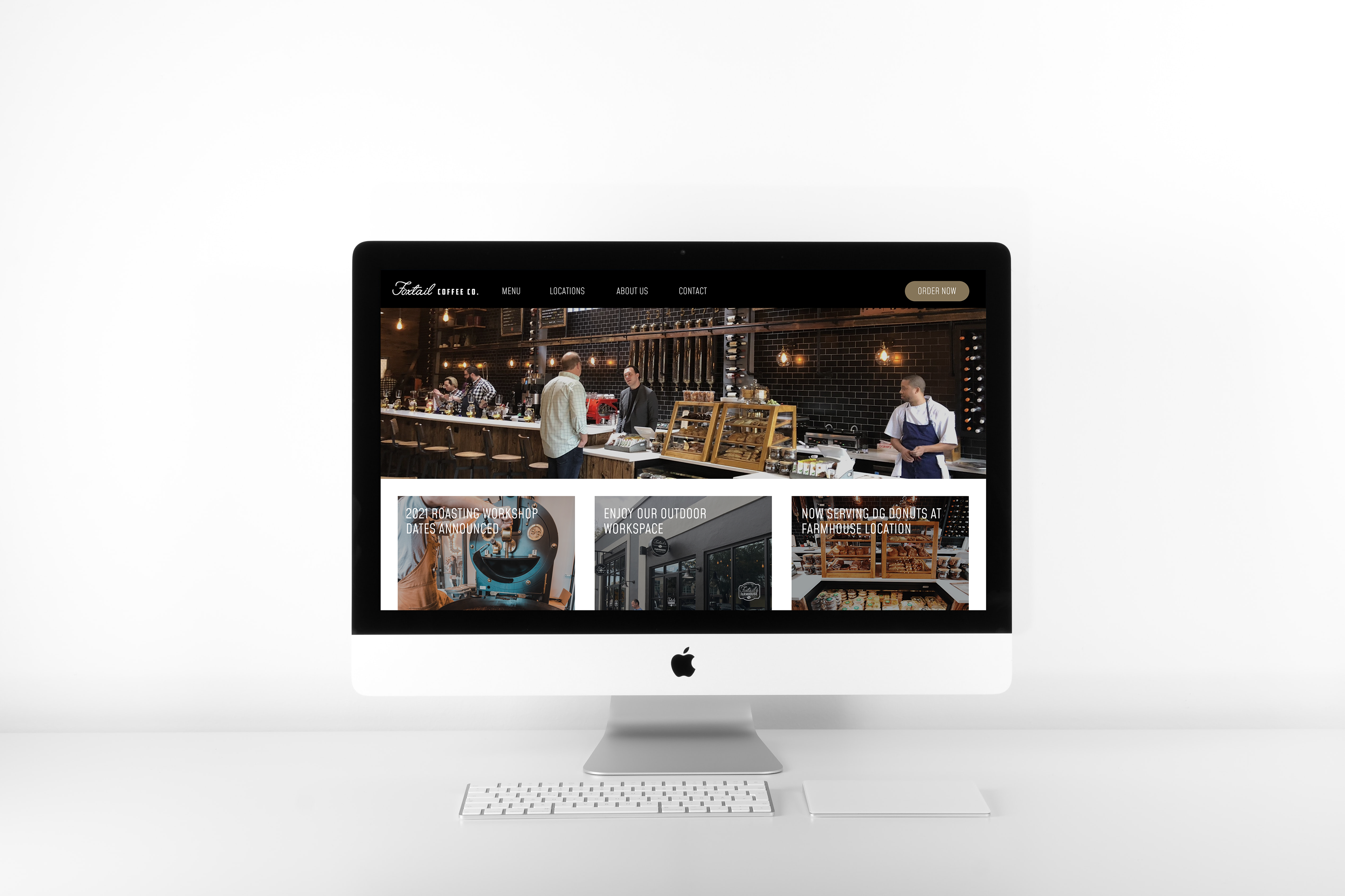 Mockup of a Mac computer showing the redesigned Foxtail Coffee Co. website, optimized for UX, UI