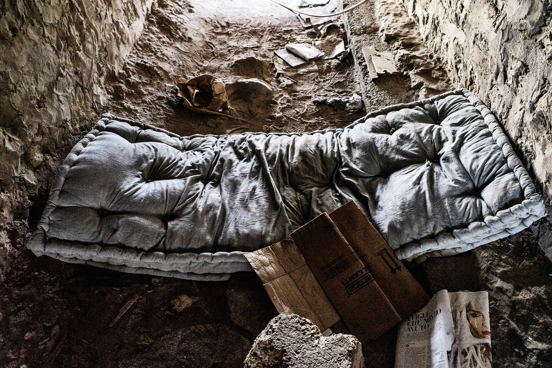 A makeshift bed in one of the tunnels inside the French-Italian railway bridge.