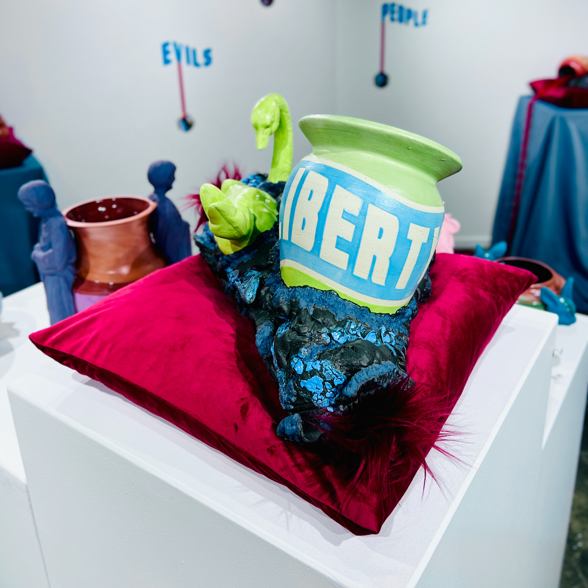 Liberty, 2024, glaze on low-fire terracotta, faux hair, 8 x 14 x 9.5 in