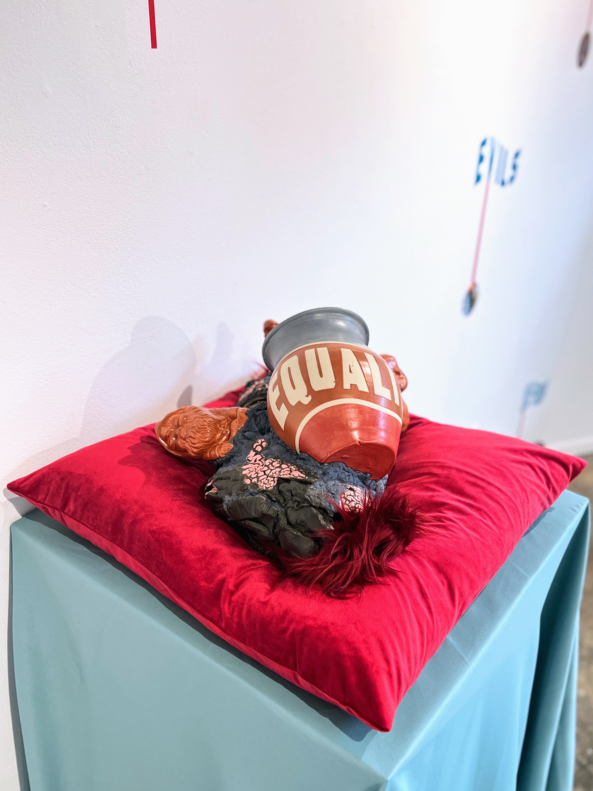 Equality, 2024, glaze on low-fire terracotta, faux hair, 21 x 14 x 11 in