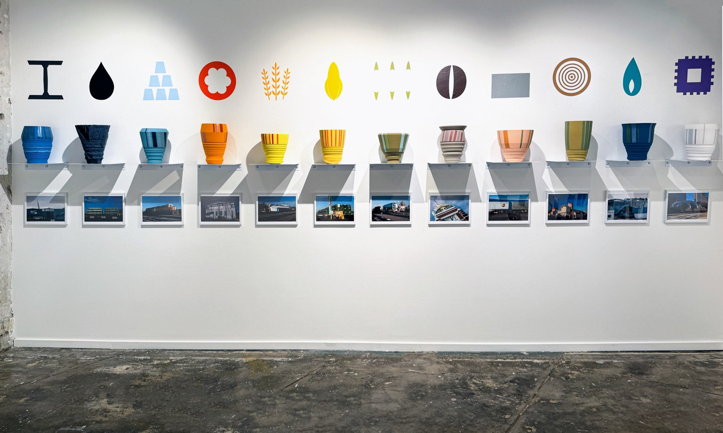 Barcode Series, installation detail, 2026, ceramic vessels, vinyl icons, and photographs, documentation image.