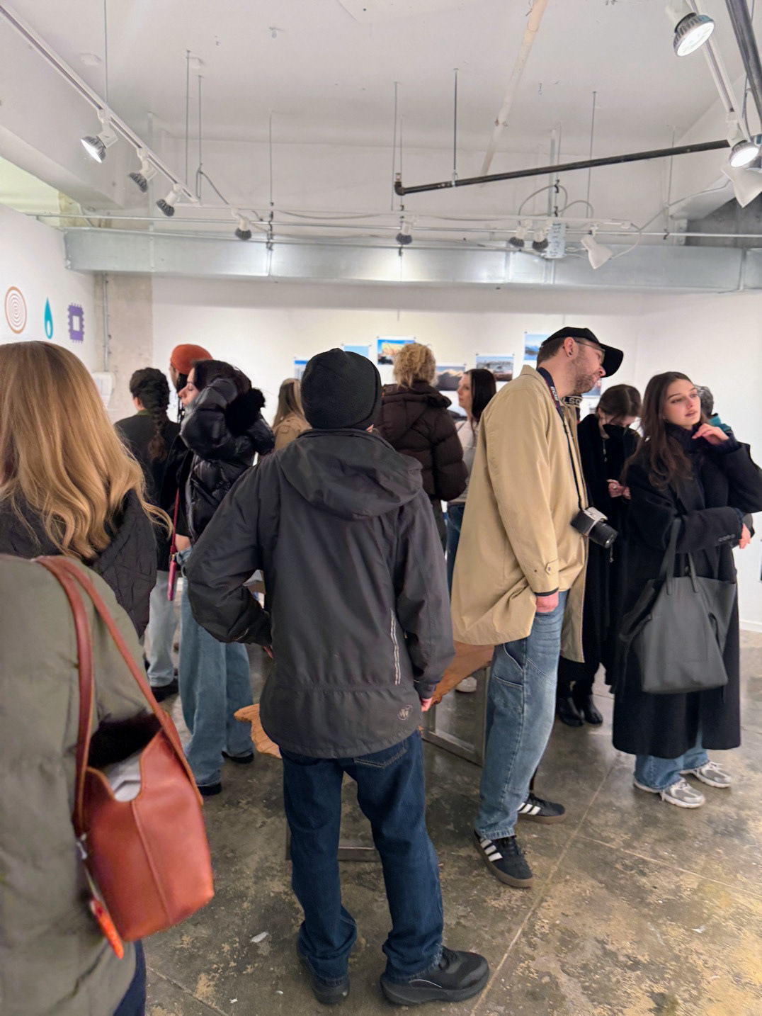 Barcode Series, installation view, 2026, ceramic vessels, vinyl icons, and photographs, documentation image, opening reception.