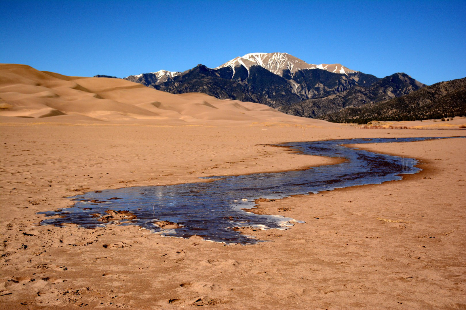 Medano Creek starting to trickle past the Great Sand Dunes in spring