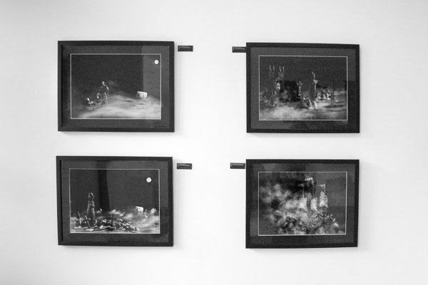 Nancy Pinkerton's panel oif images 'calling up storms in black mounts and frames on display on a gallery wall