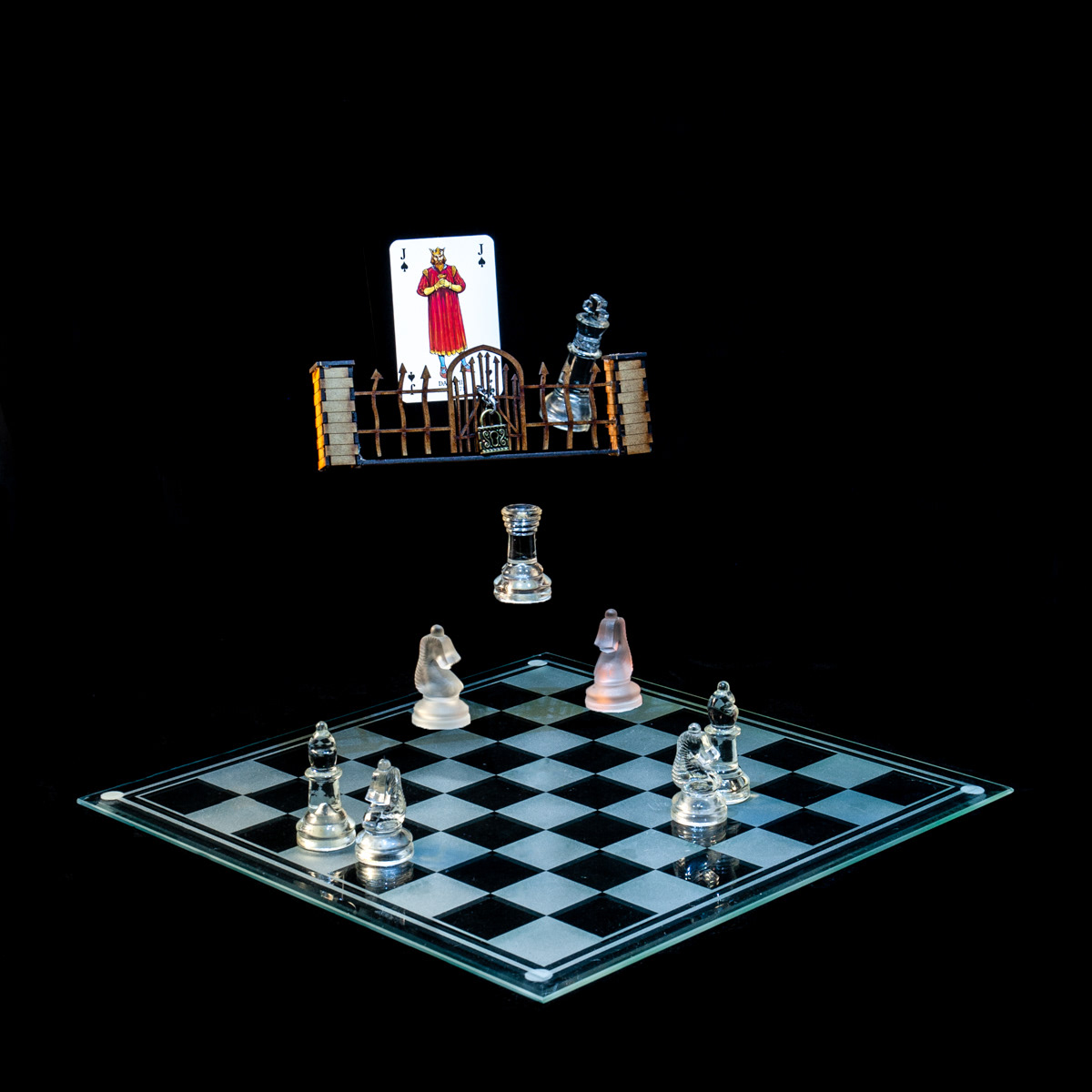 Photographic art that tells the story of David II's imprisonment in the Tower of London for over a decade, using a chessboard, playing card and objects.