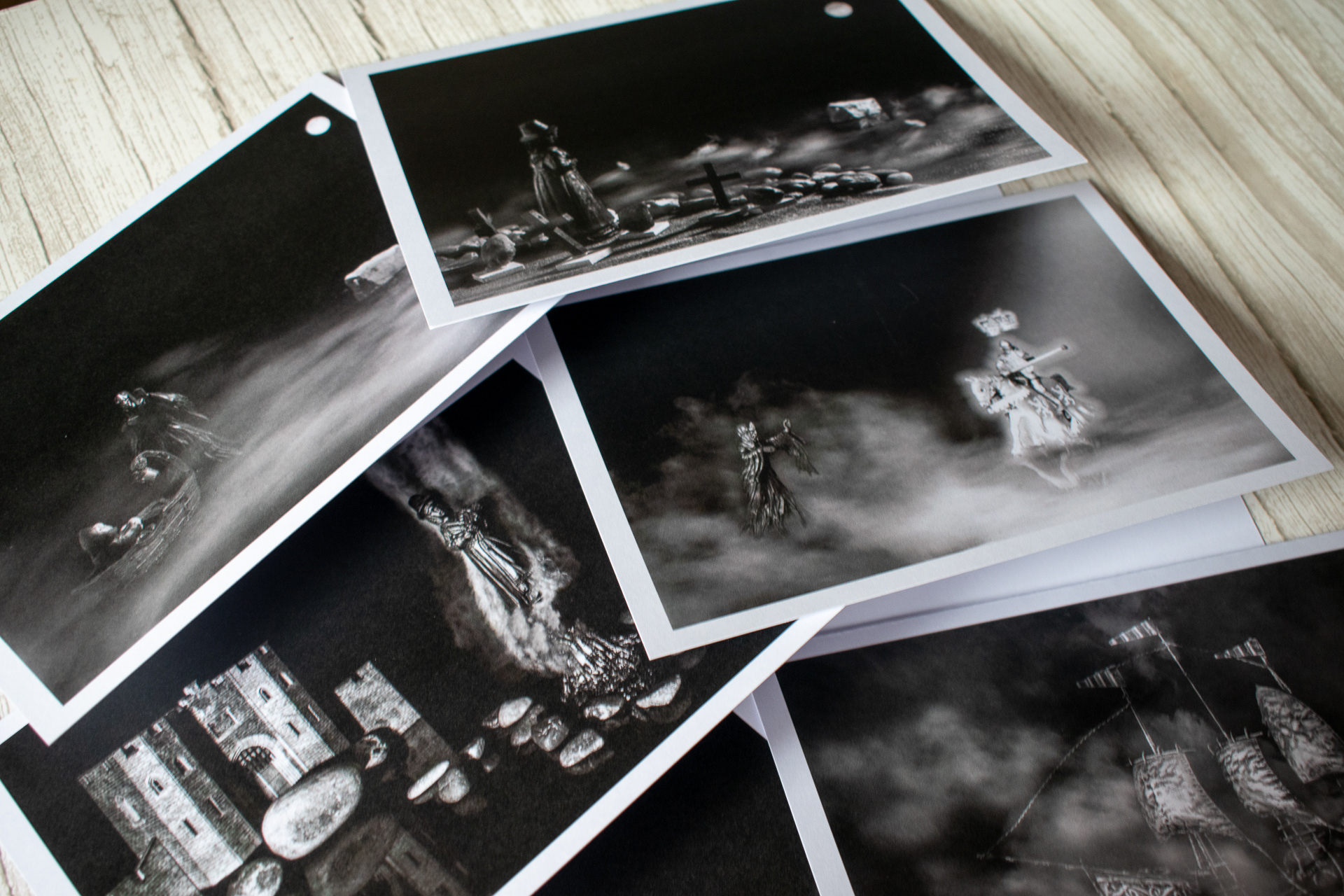 close up of greeting cards featuring the witches the devil and a king collection