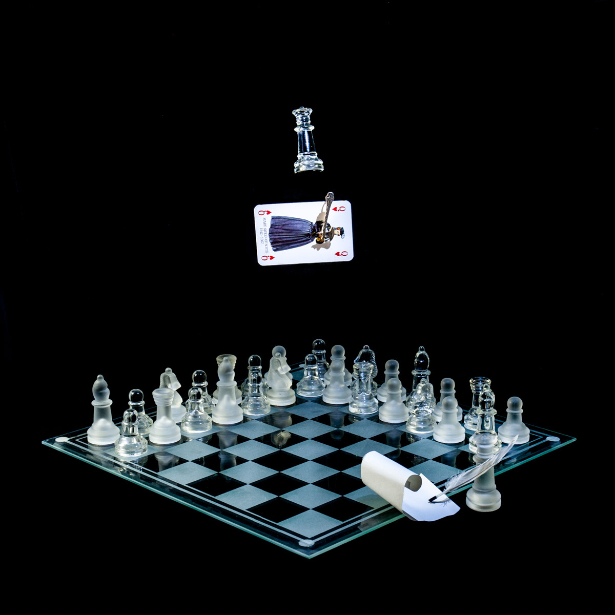 Photographic art that tells the story of Mary, Queen of Scots who was executed by Elizabeth I for treason, using a chessboard, playing card and objects.