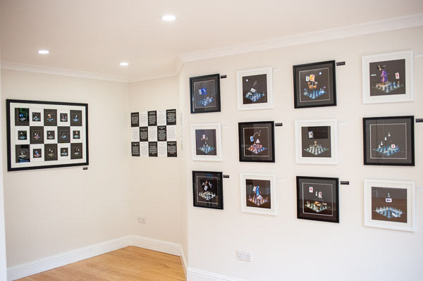 Nancy Pinkerton's collection Scotland's Chequered Throne on display in alernating black and white mounts on the wall of a gallery