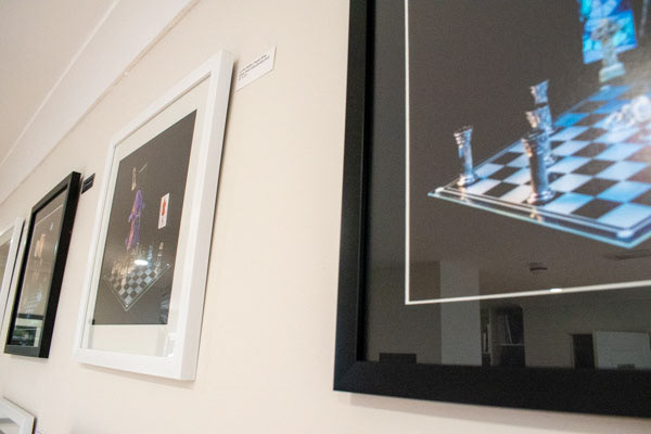close up of frame Scotland's Chequered throne images on a gallery wall.