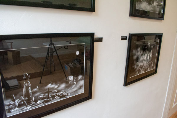close up of 4 framed images from the Witches the devil and a king collection on a white gallery wall