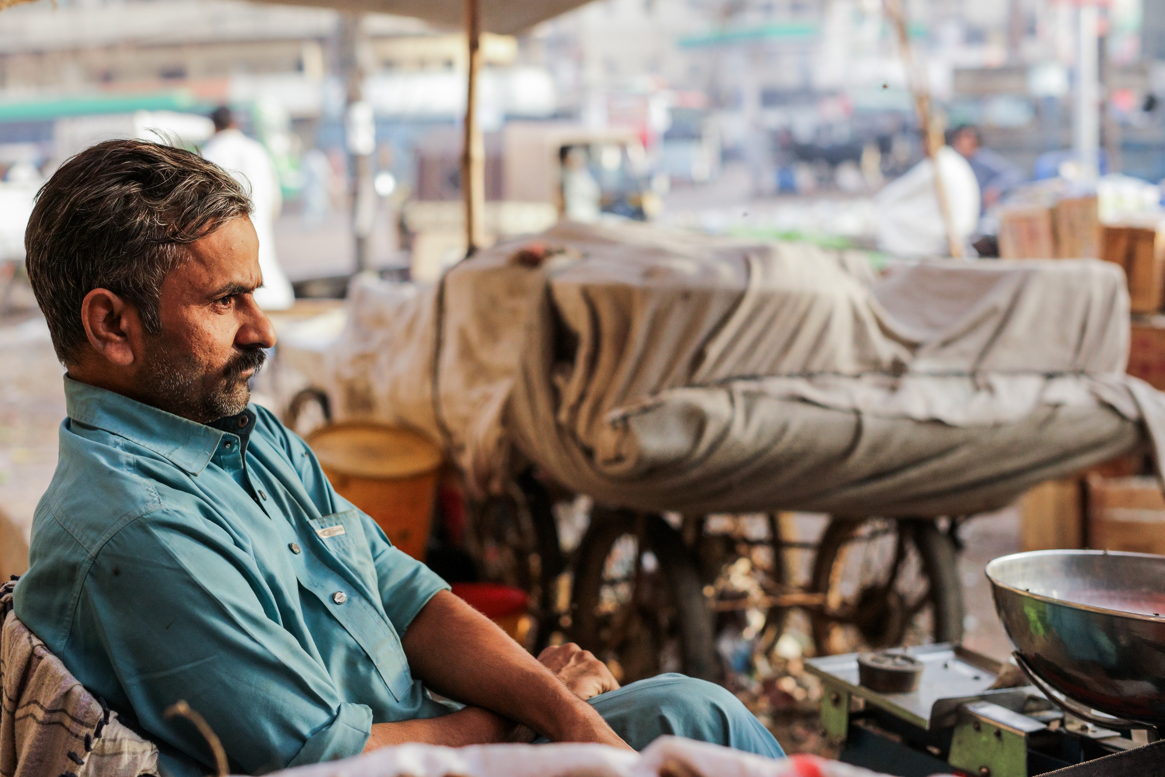 A vegetable vendor awaits for customers amidst the price hikes in Lee Market, Karachi, Pakistan on December 25th 2021.