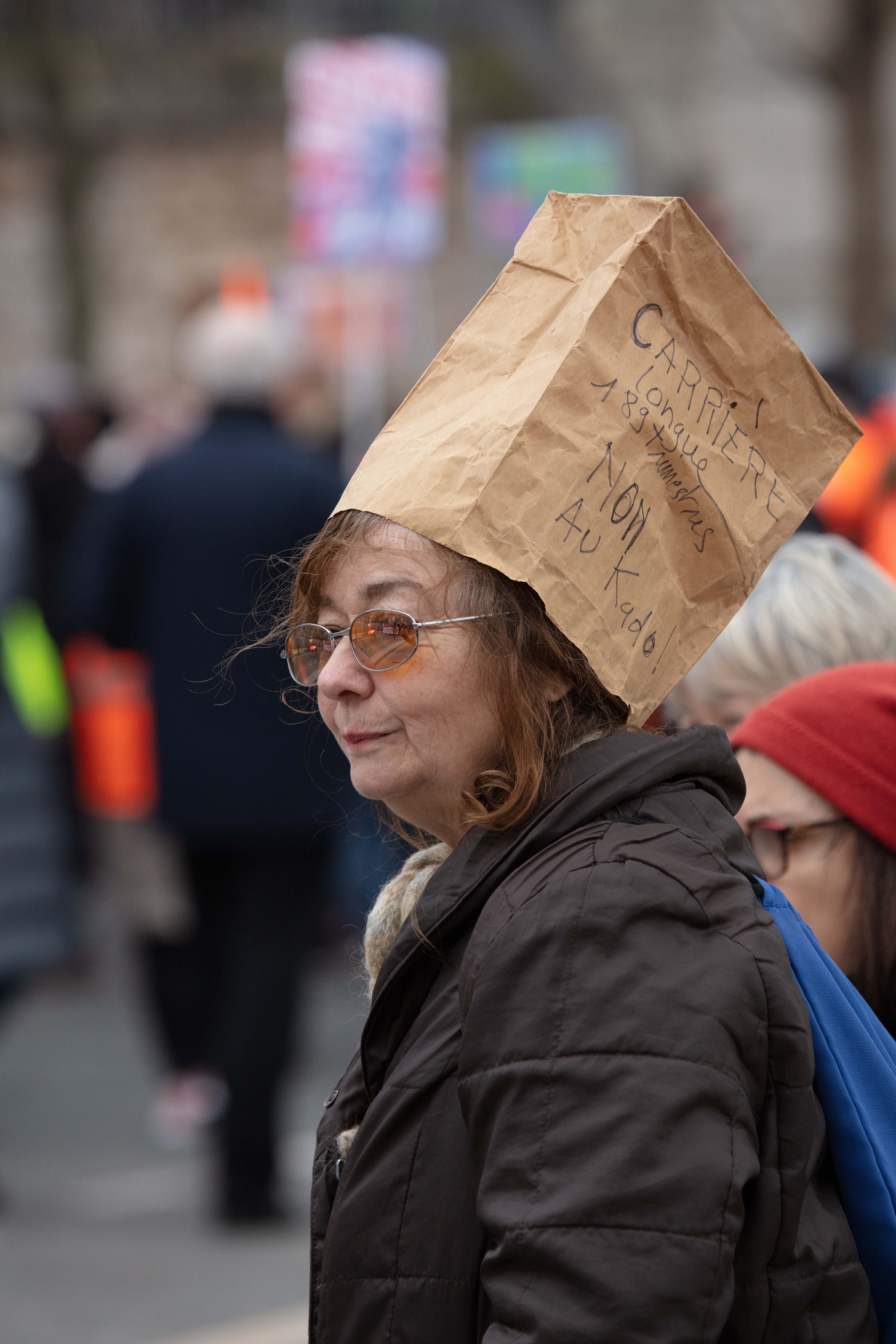 An old protester stands in solidarity at protest against pension reforms in Paris, France, January 19th 2023.