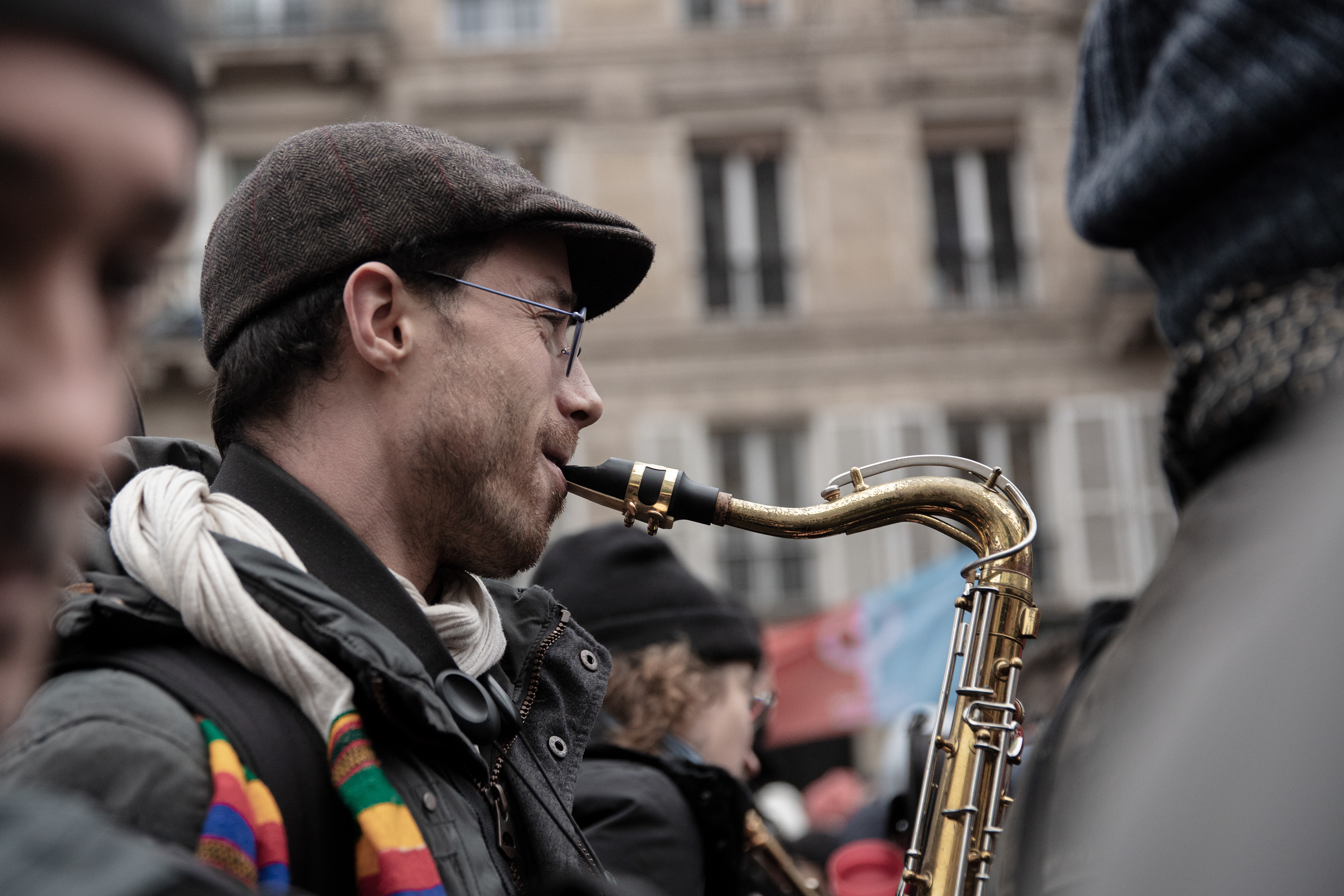 A musician playing saxophone during the demonstration to denounce recently proposed pension reforms that would raise the retirement age, in Paris, France, January 19th 2023.
