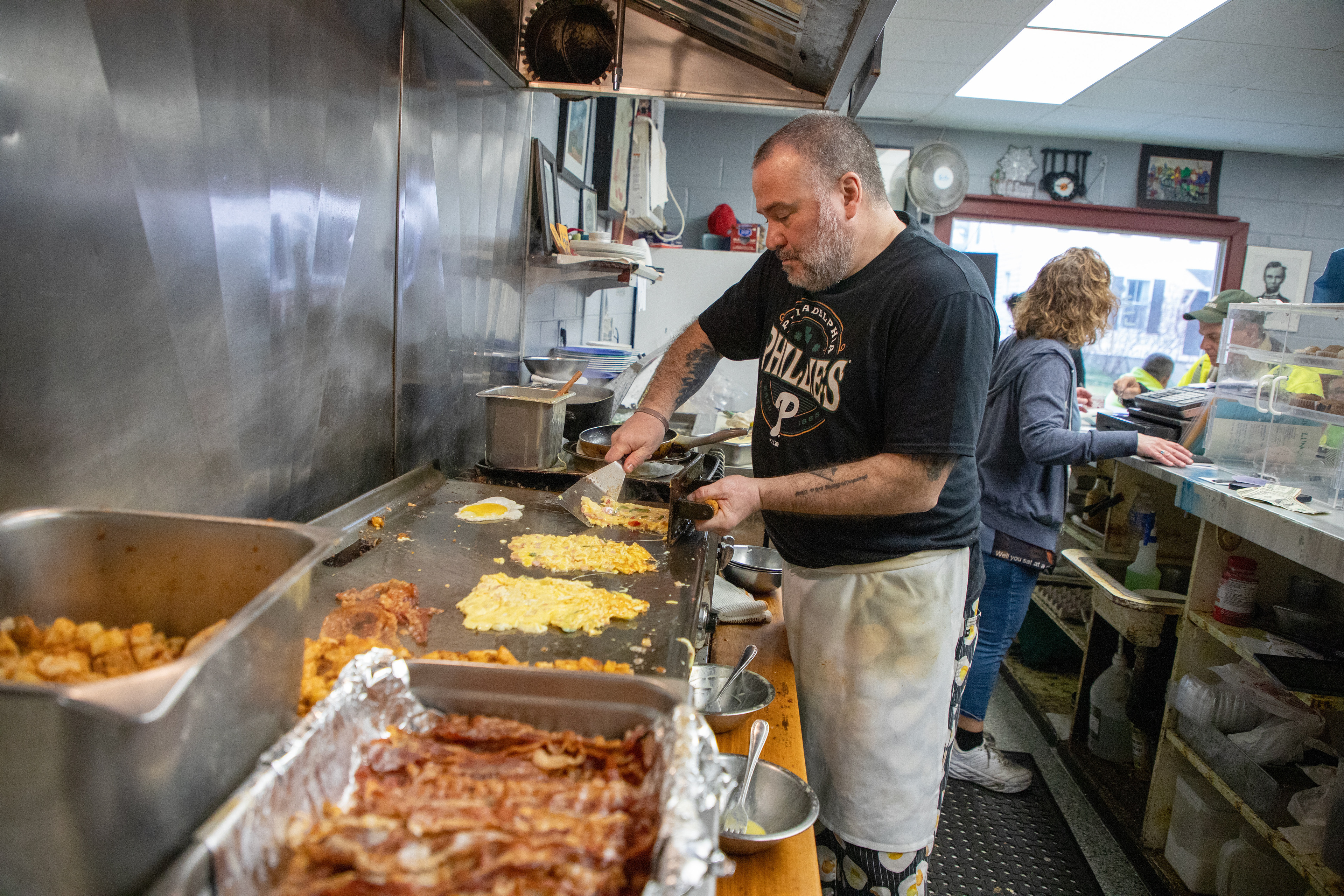 Business owner Christopher Obrien cooks breakfast for customers Wednesday, Mar. 6, 2024 at Lincoln Street Diner, Ithaca, NY. Obrien works as the main chief and has been running Lincoln Street Diner for 20 years. Photo by Xinyi Qin.