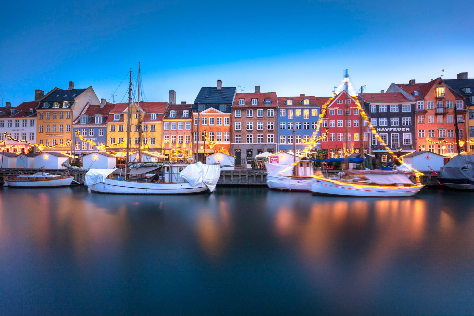 beautiful houeses  of nyhavn  during blue hour with christmas lights and decorations...............