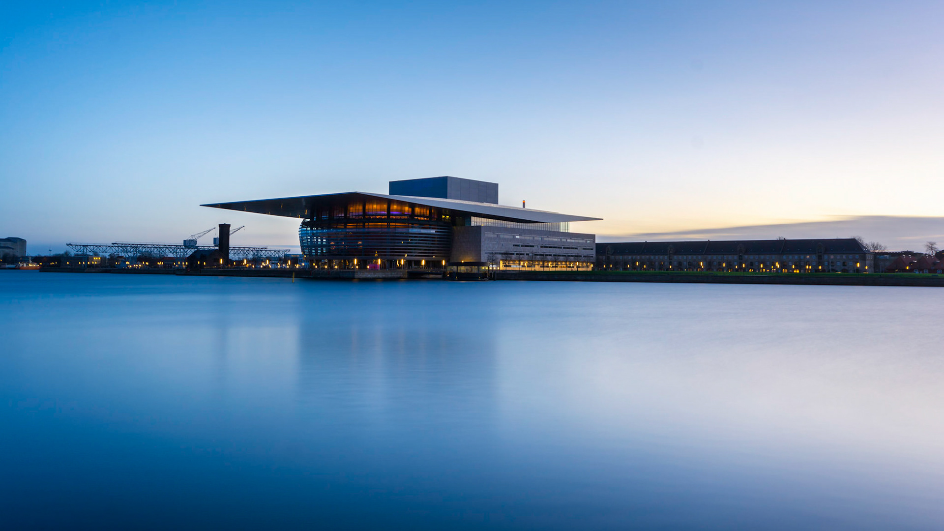 Open house with smooth water during late blue hour