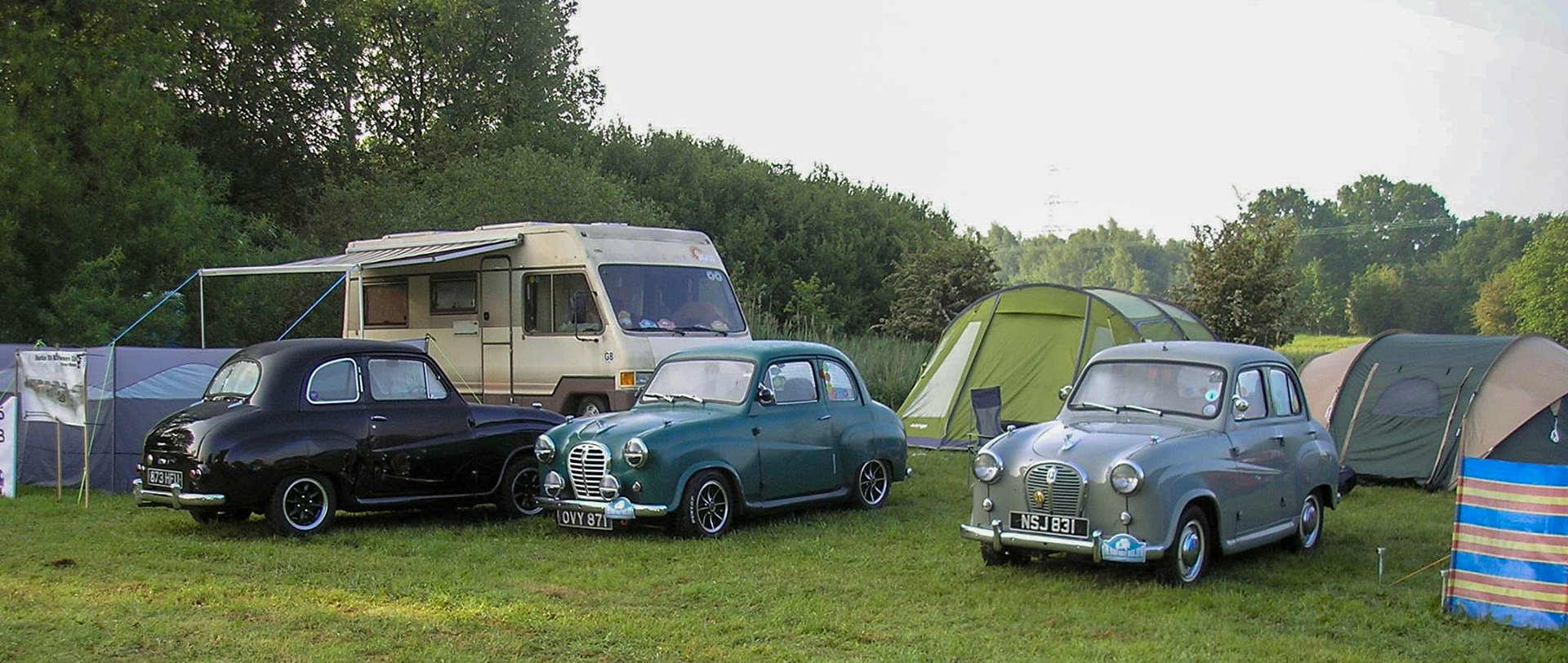 Motorhome with some of the young members cars