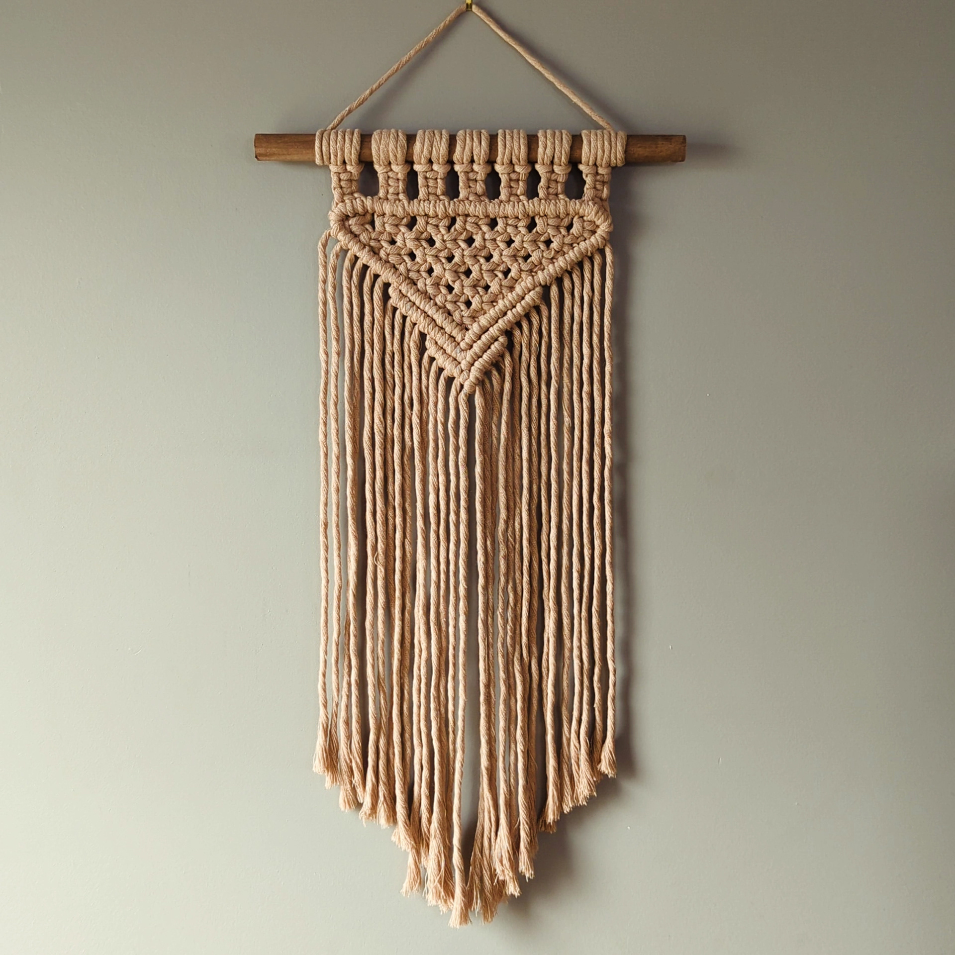 Peach narrow macrame wall hanging 