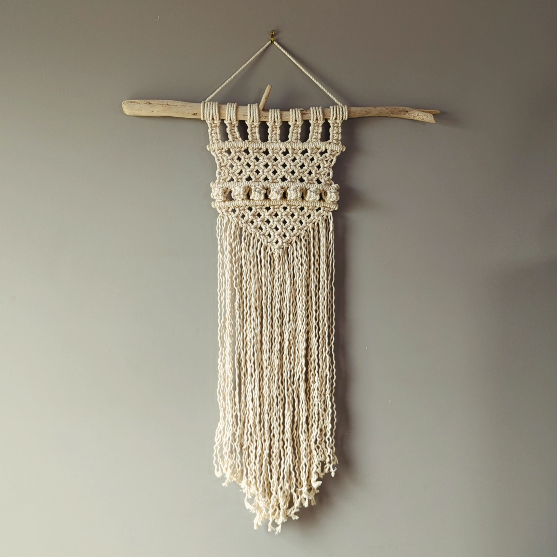 Beige narrow macrame wall hanging