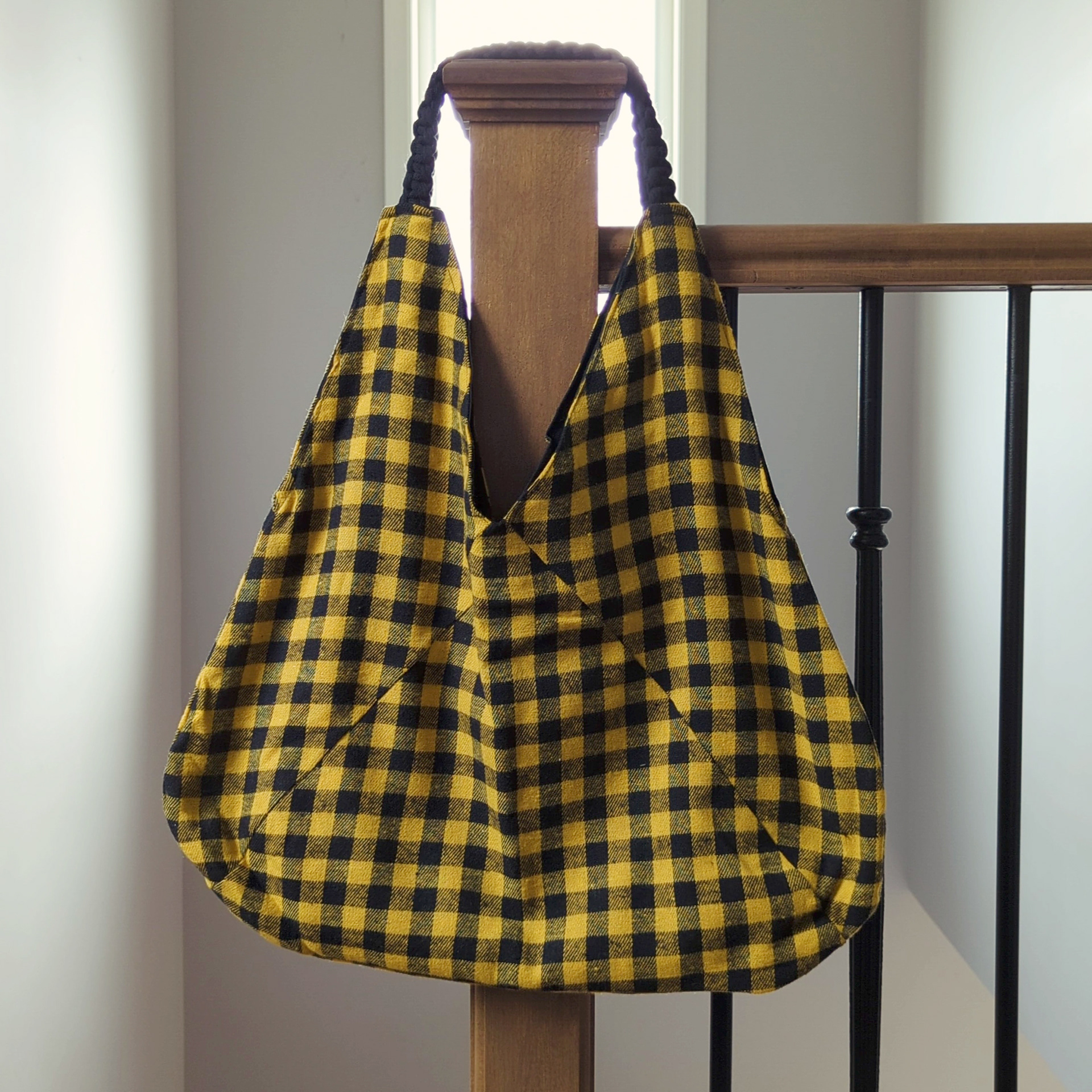 Yellow & Black buffalo check bag with black interior and black macrame straps