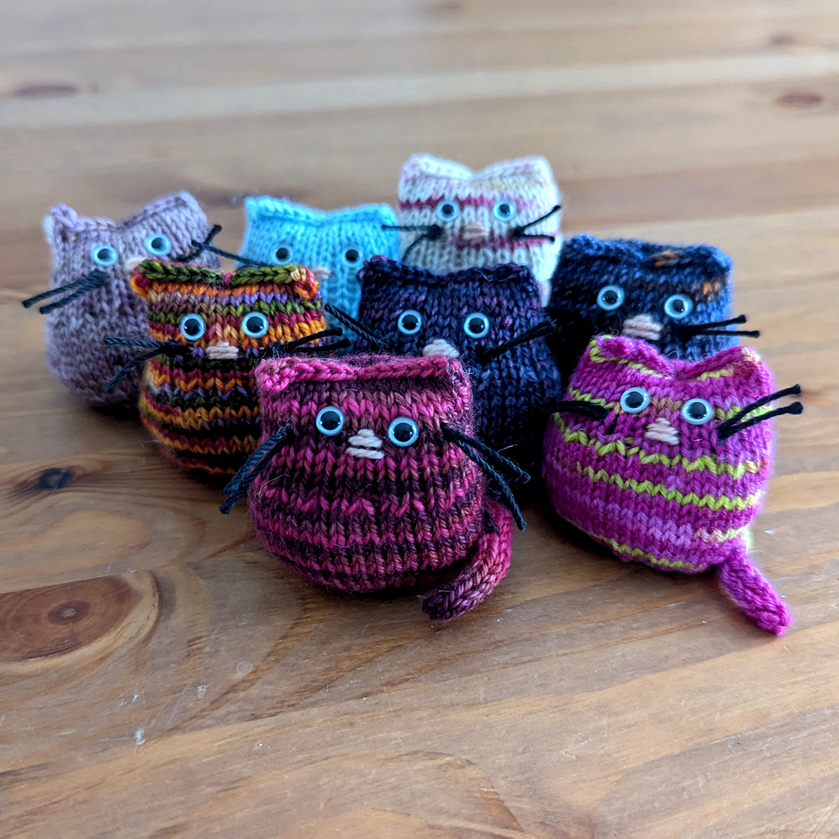 Tiny knitted kittens in various colours