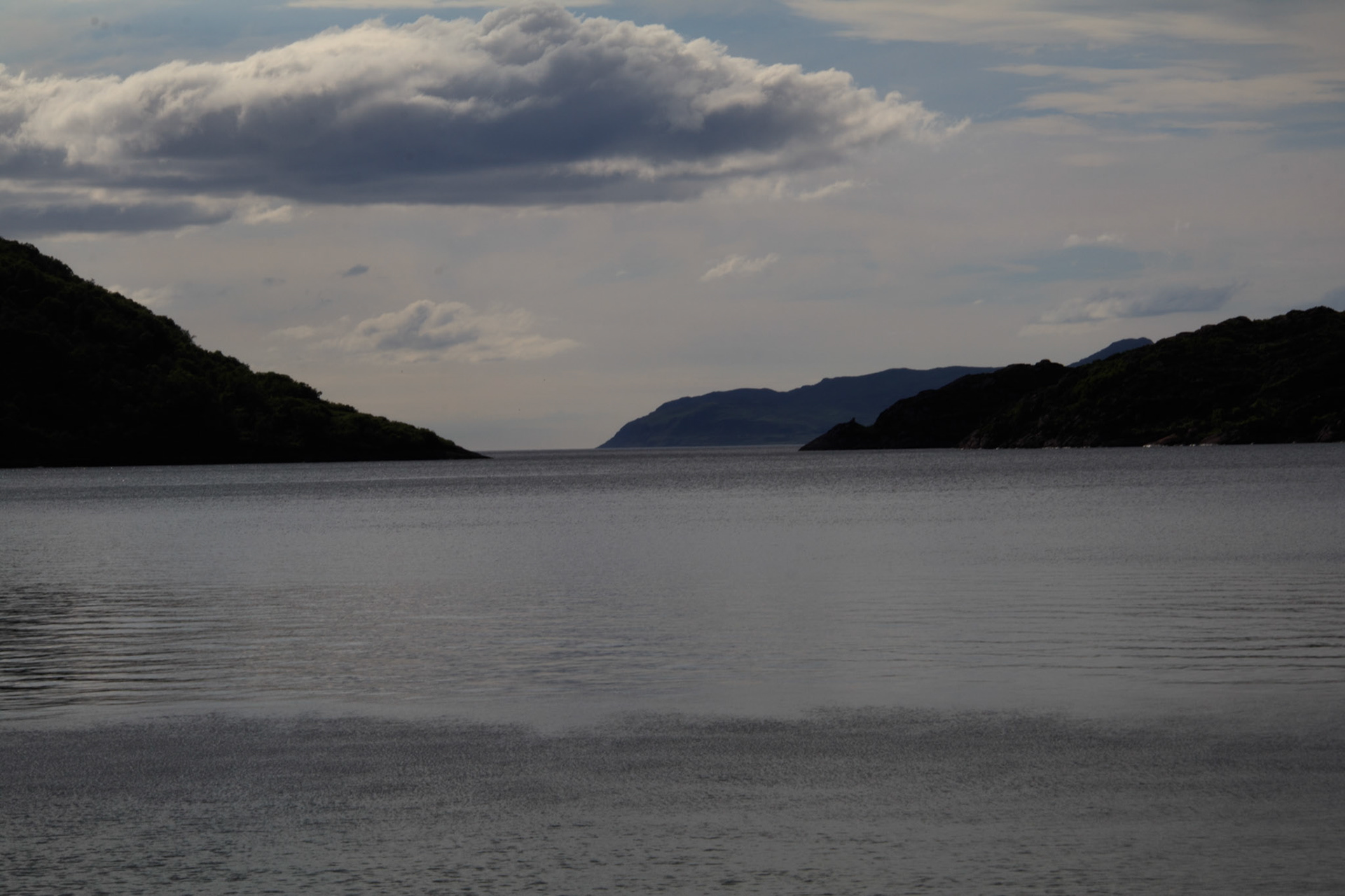 looking west out of Drambuie -Coll and Tiree  in the mist - Ardnamurchan point to the right