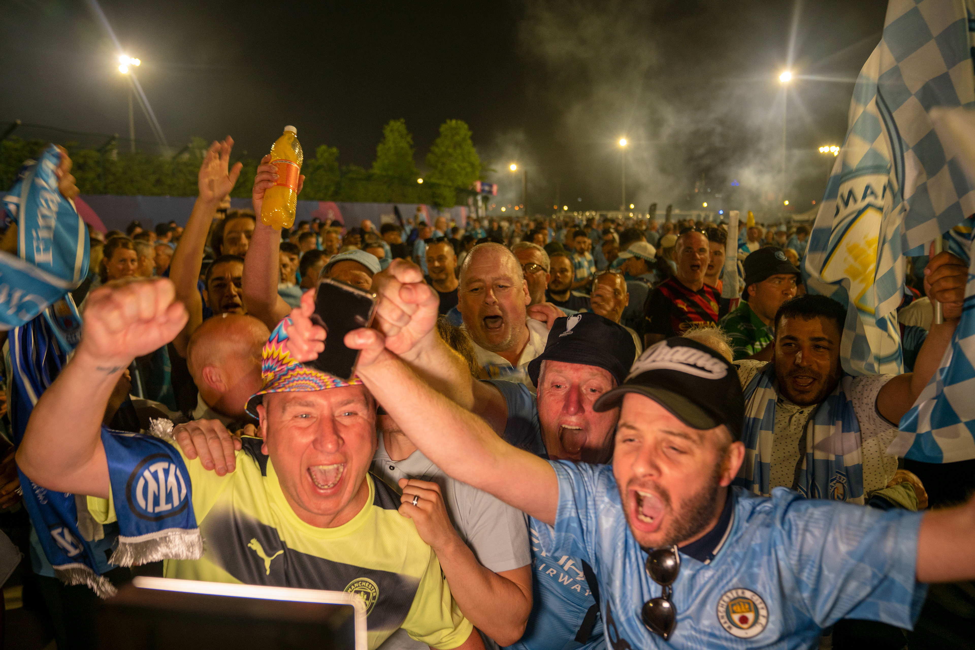 Manchester City fans celebrate their team that won the UEFA Champions League title victory in front of the Ataturk Olympic Stadium in Istanbul, on June 11, 2023.