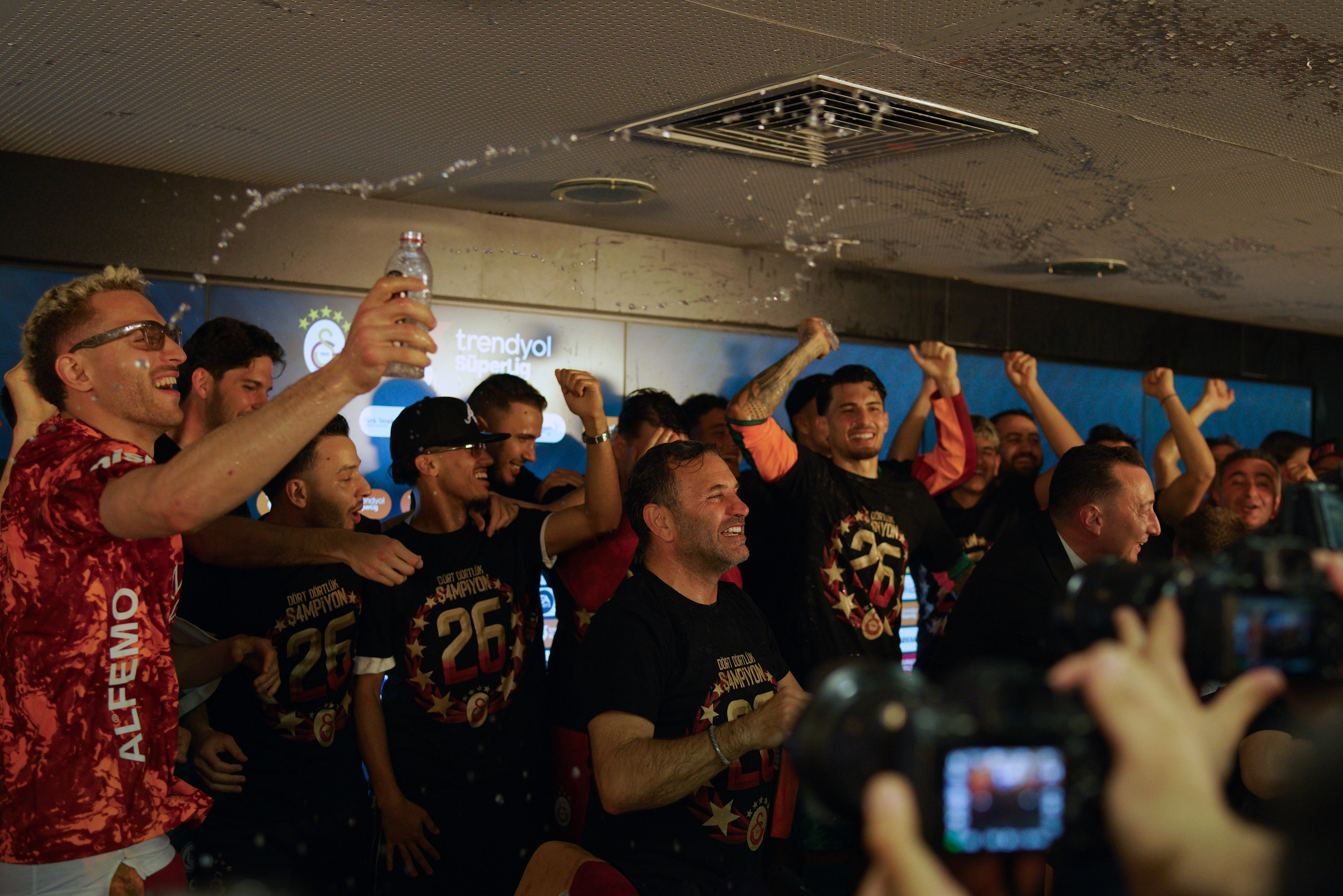 Galatasaray players and coach Okan Buruk celebrating their 2025-2026 Turkish Super League championship in the press room during a match played in Istanbul on May 9, 2026.