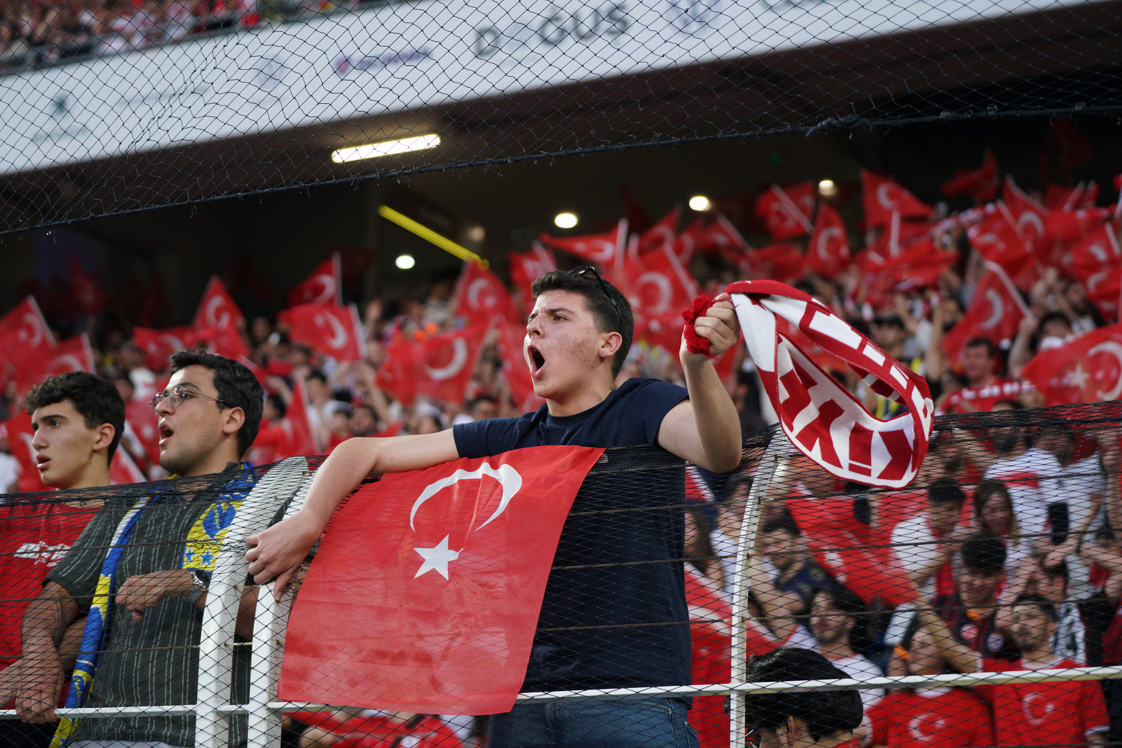 Turkish national team fans chant slogans and wave Turkish flags ahead of the Turkey-North Macedonia match, to be played at Fenerbahce Sukru Saracoglu Stadium in Istanbul on June 1, 2026, as part of the preparations for the 2026 FIFA World Cup.