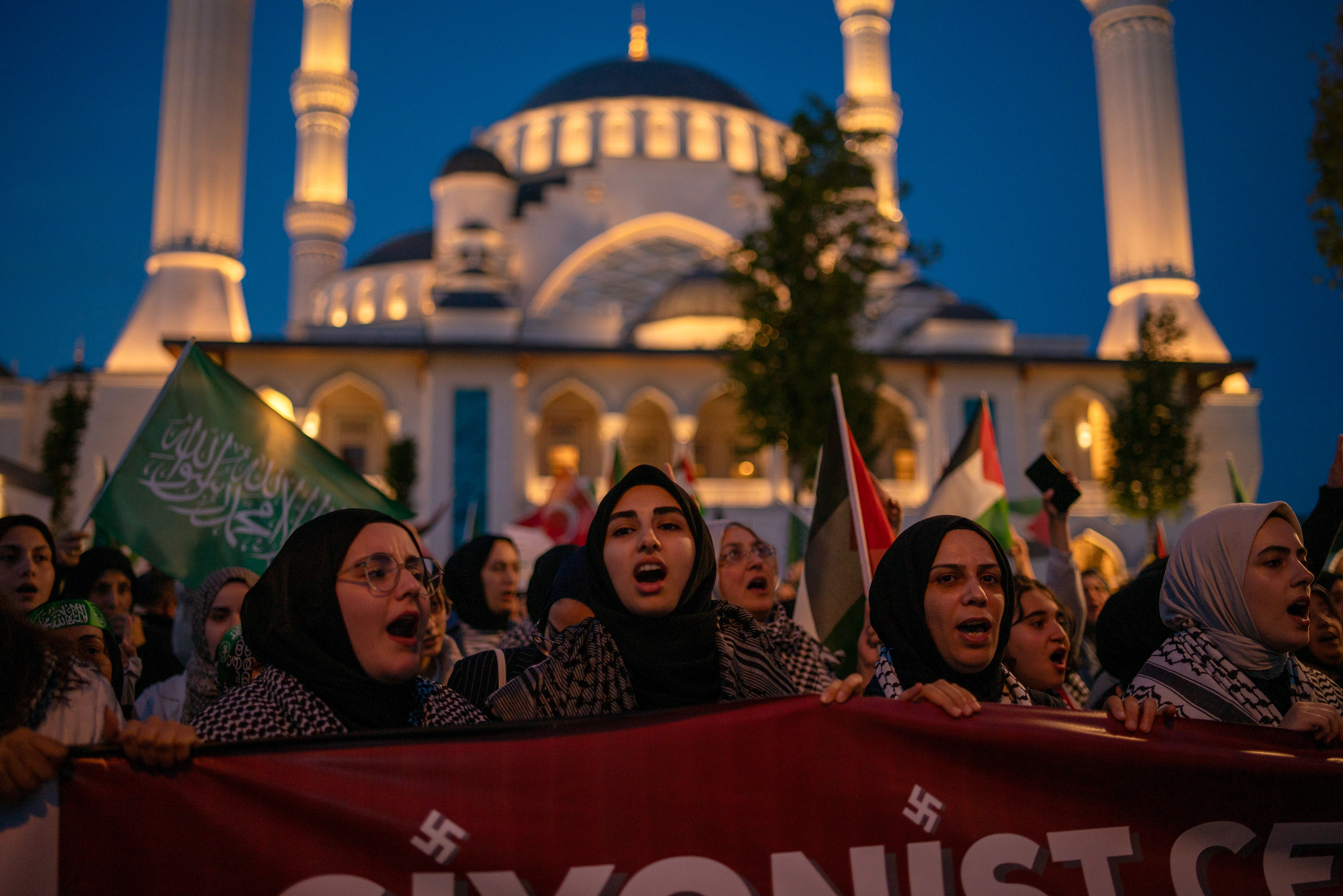 Protestors shout slogans during a protest solidarity with the Rafah people march from Barbaros Hayrettin Pasa Mosque to in front of the Israeli Consulate in Istanbul on May 27, 2024.