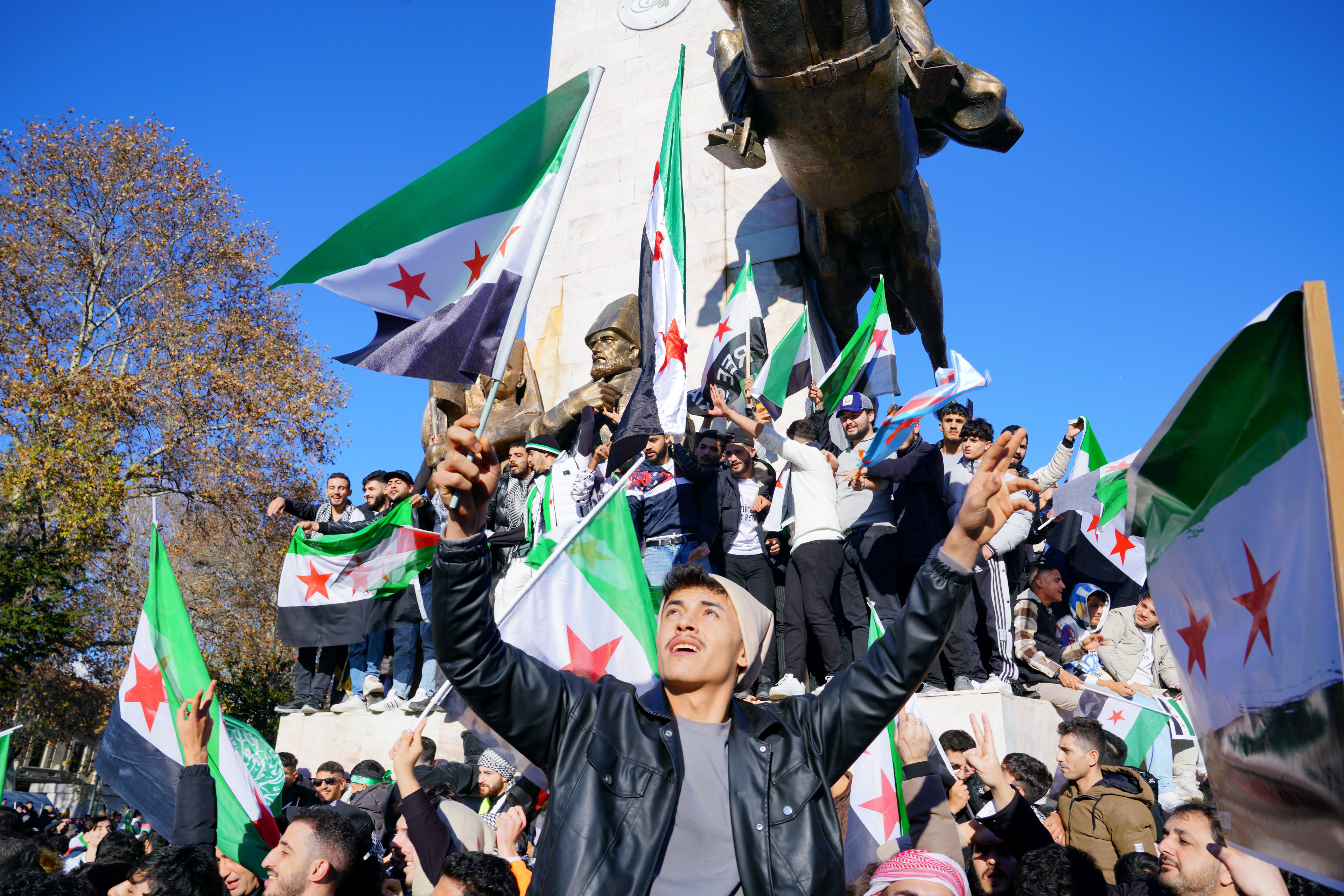 Syrians living in Turkey celebrate after Syrian rebels announced that they have ousted President Bashar al-Assad, at Sarachane Square in Istanbul, Turkey, December 8, 2024.