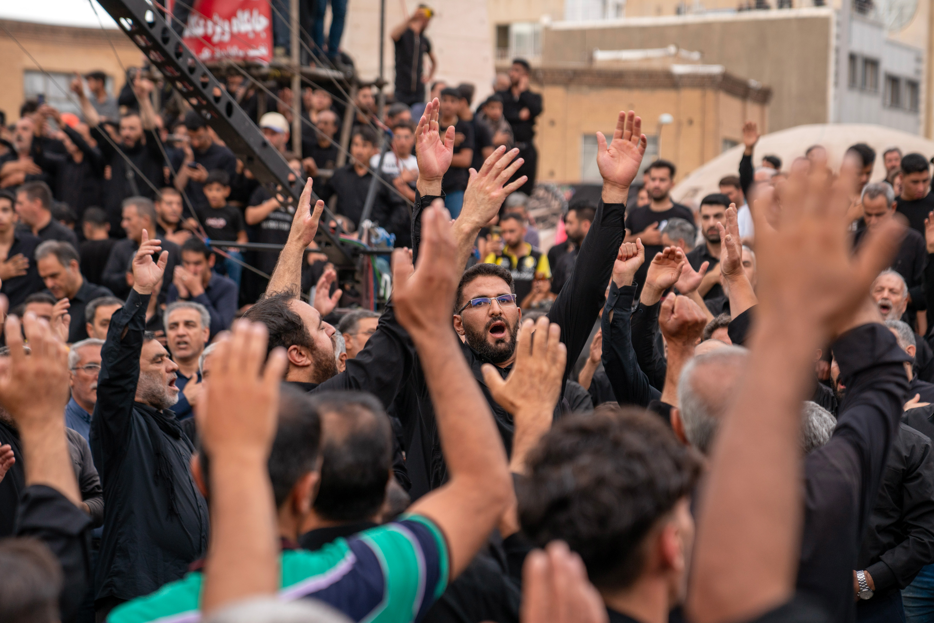 Shiite Muslims in Iran sing hymns in Enghelab Square in Zanjan, the day after the Day of Ashura, the 1384th anniversary of Imam Hussein's martyrdom. 
