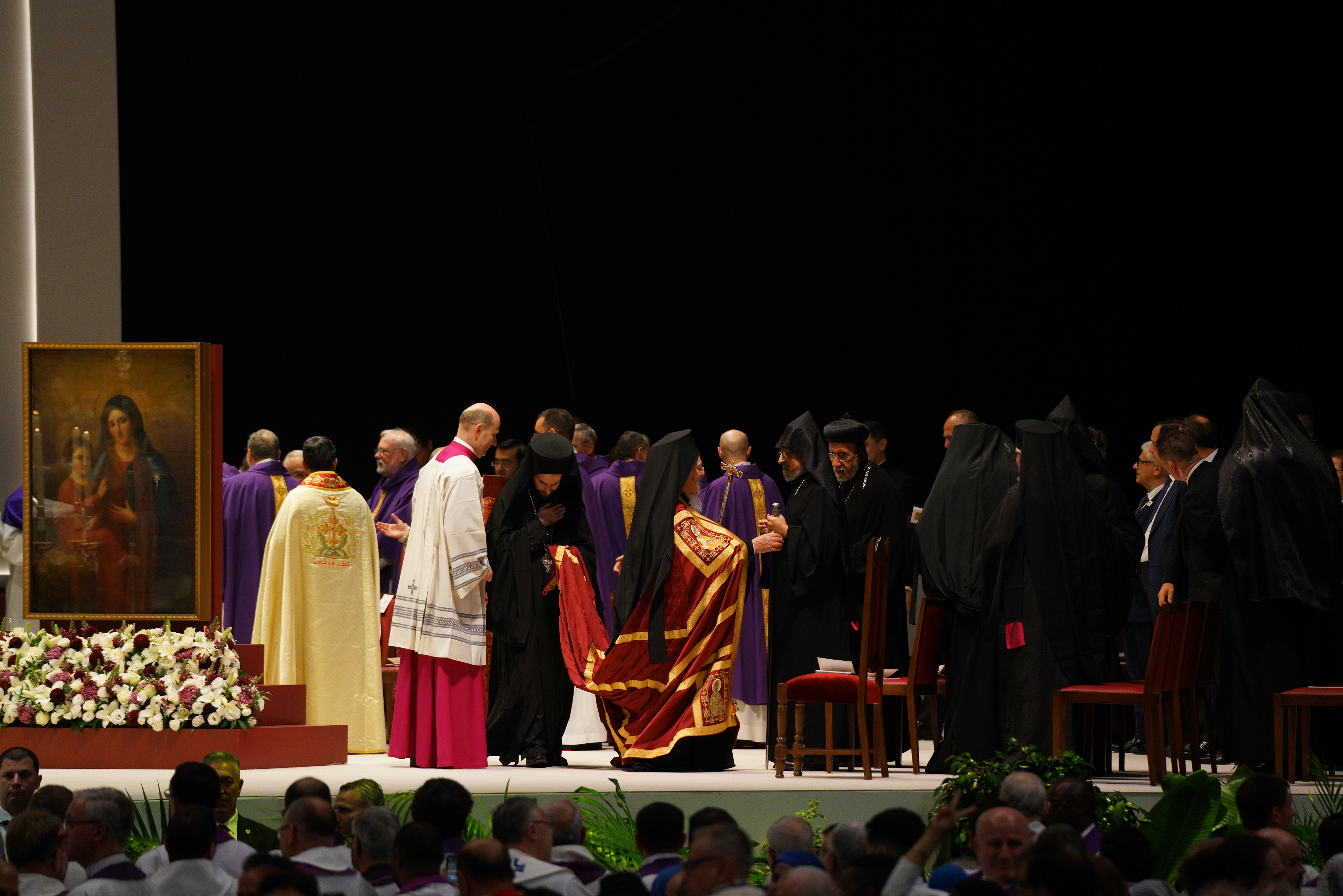 Ecumenical Patriarch Bartholomew I (C) attends as Pope Leo XIV celebrates a Mass at the Volkswagen Arena in Istanbul, during his first apostolic journey, on November 29, 2025.