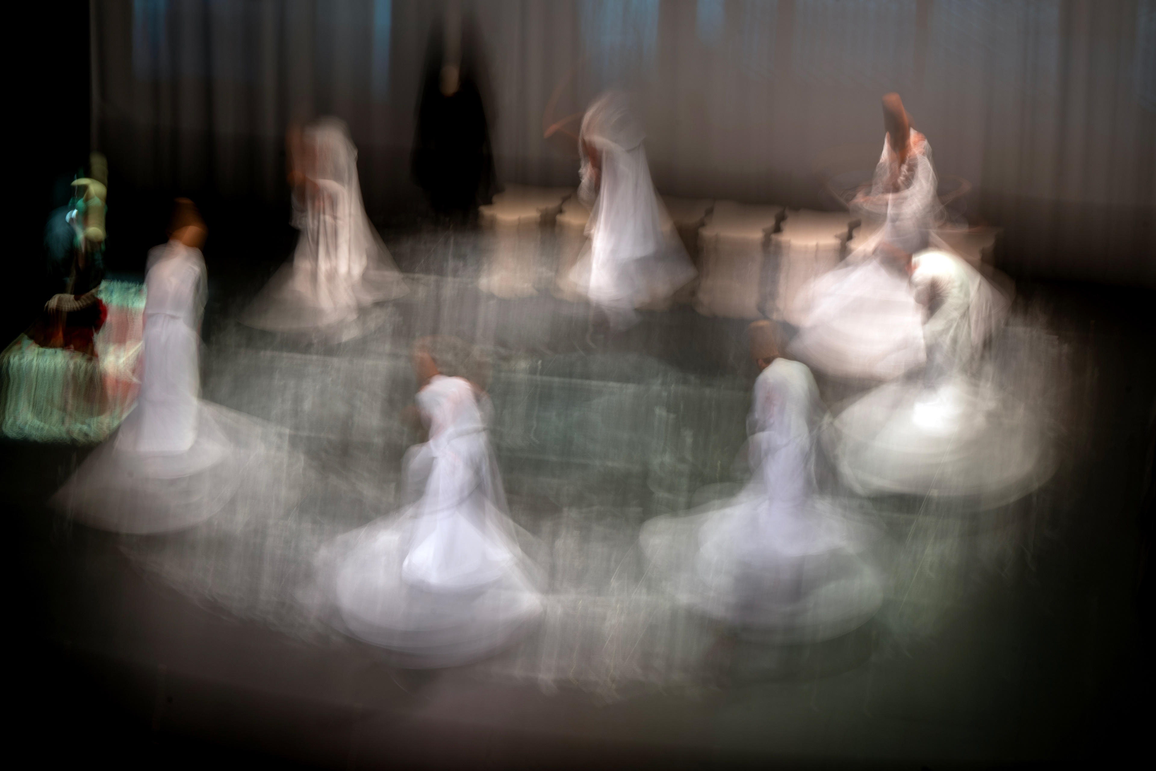 Whirling dervishes perform during at the ''Seb-i Arus'' ceremony on the 750th death anniversary of Mevlana at İstanbul's Ataturk Cultural Center, commonly called the AKM. Mevlana Celaleddin-i Rumi is a Sufi mystic poet who lived in the 13th century. 