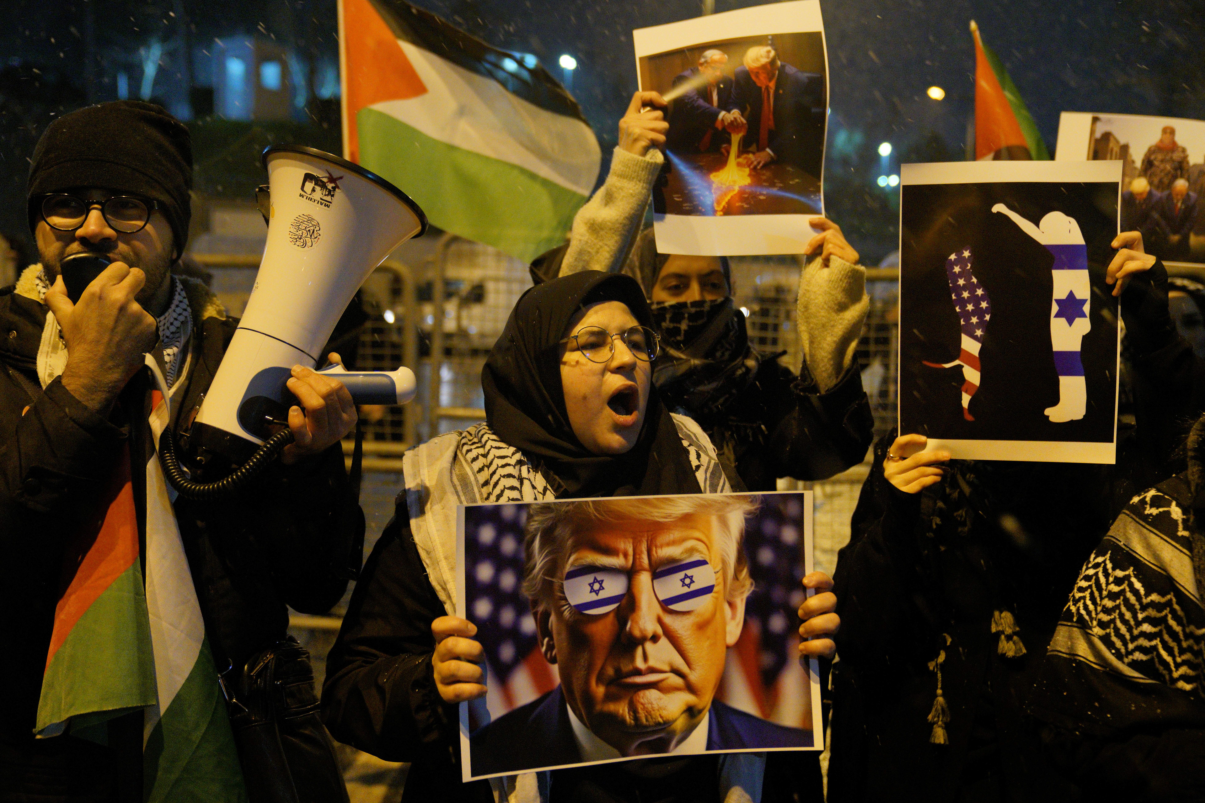 A pro-Palestine protester hold a picture of US President Donald Trump outside US Consulate General in Istanbul on February 6, 2025 as protest that US President Donald Trump, in a joint press statement with Israeli Prime Minister Benjamin Netanyahu, said on February 4, 2025 that the US will "take over" the Gaza Strip, that they would "own" it, and that Palestinians living in Gaza should move to neighboring countries.