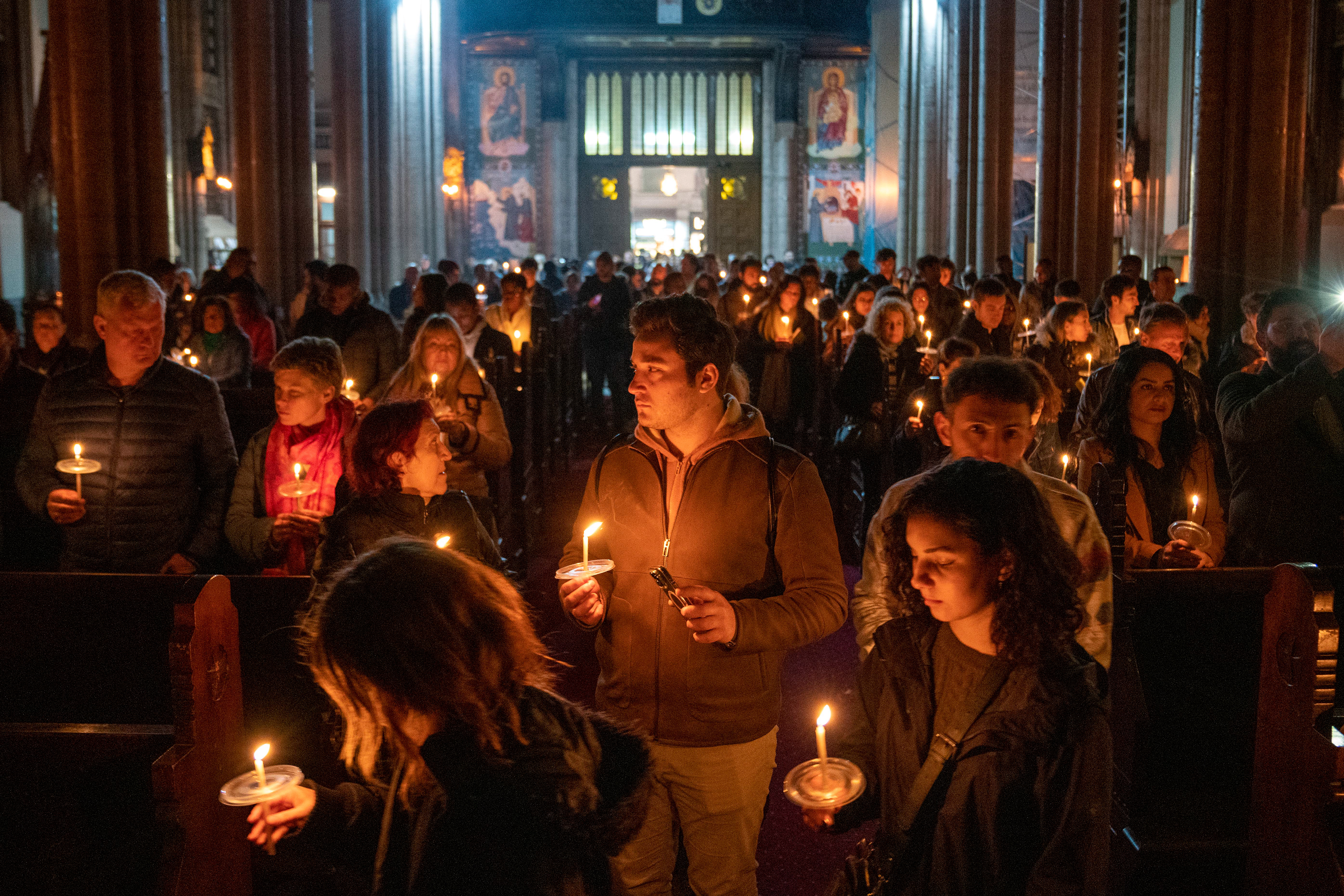 On Holy Saturday, rite of light was held at the St. Antony of Padua Church, locally known as Sent Antuan, is the largest Catholic Church in Istanbul. Priests and the congregation enter the Dark Church with candles in their hands on April 8, 2023.