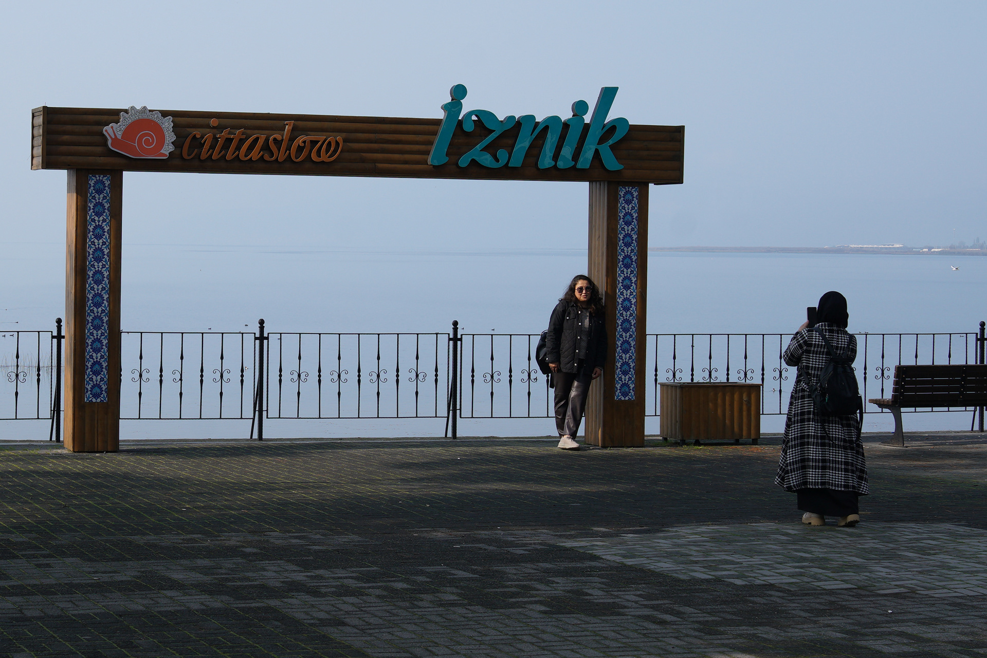 A woman pose for pictures by a lake in Iznik, Turkey where Pope Leo is expected to visit for the 1,700th anniversary of the First Nicaea Council, during his trip to Turkey in November as part of his first trip outside Italy, November 7, 2025.