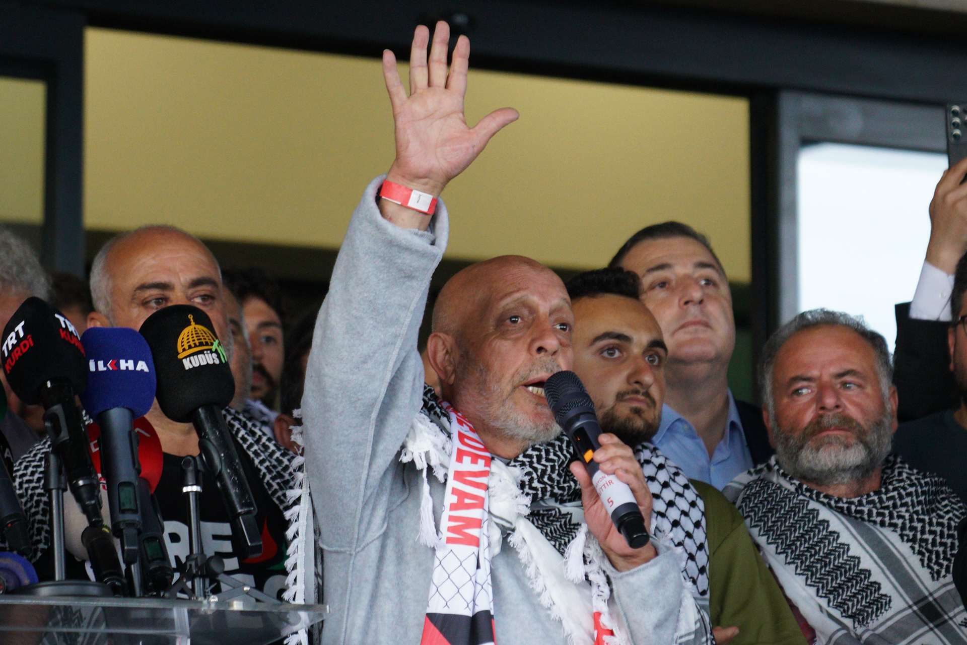Turkish activist, who was detained aboard the Gaza-bound Global Sumud Flotilla, which was intercepted by Israeli forces, is speaks to the media as he arrives at Istanbul International Airport after being deported, in Istanbul, Turkey, May 21, 2026.