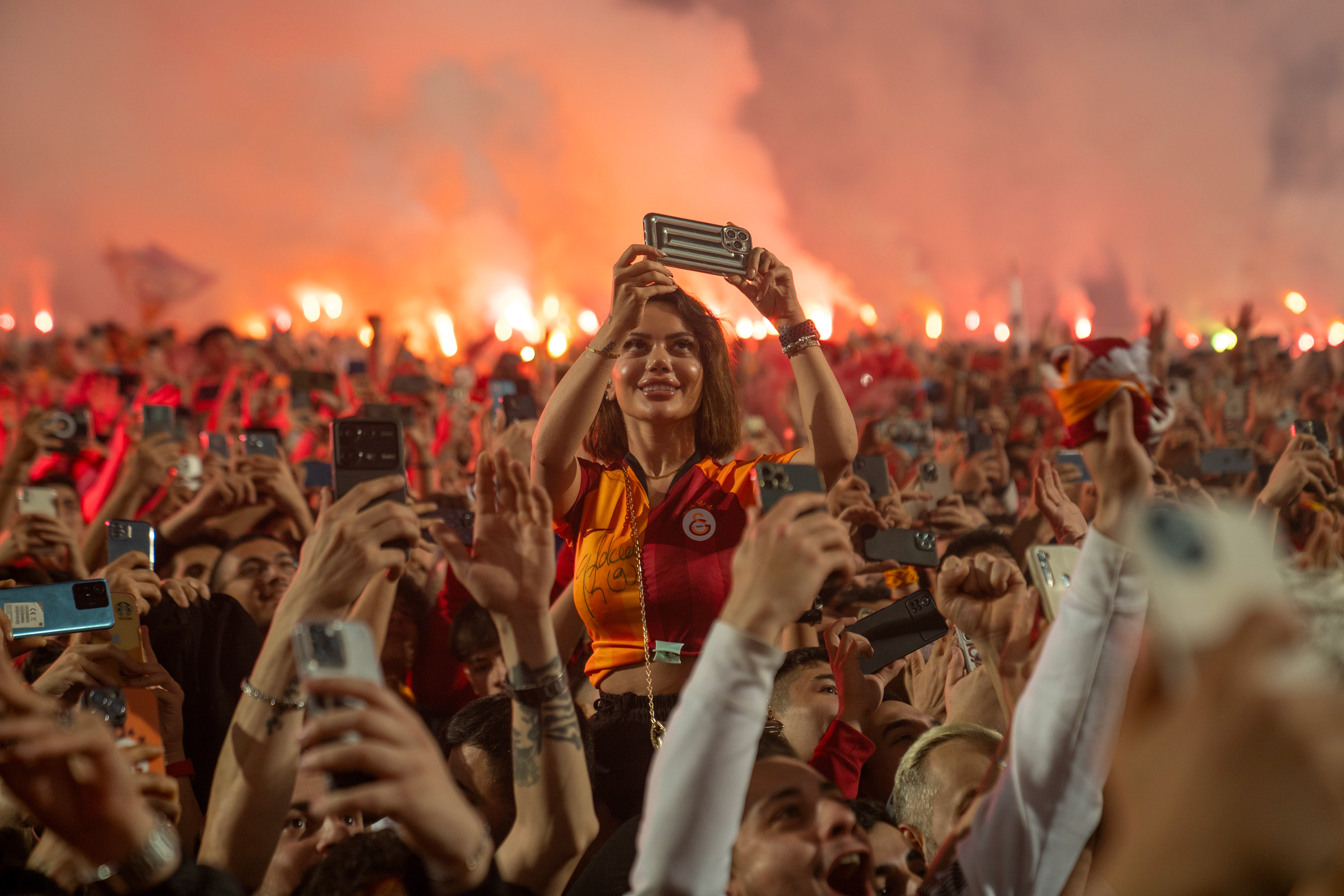 Fans of Galatasaray celebrate at Metin Oktay Sports Complex and Training Center, in Florya, Istanbul after their club won the 24th Turkish league title on May 27, 2024 with a victory against Konya in their last match of the season.