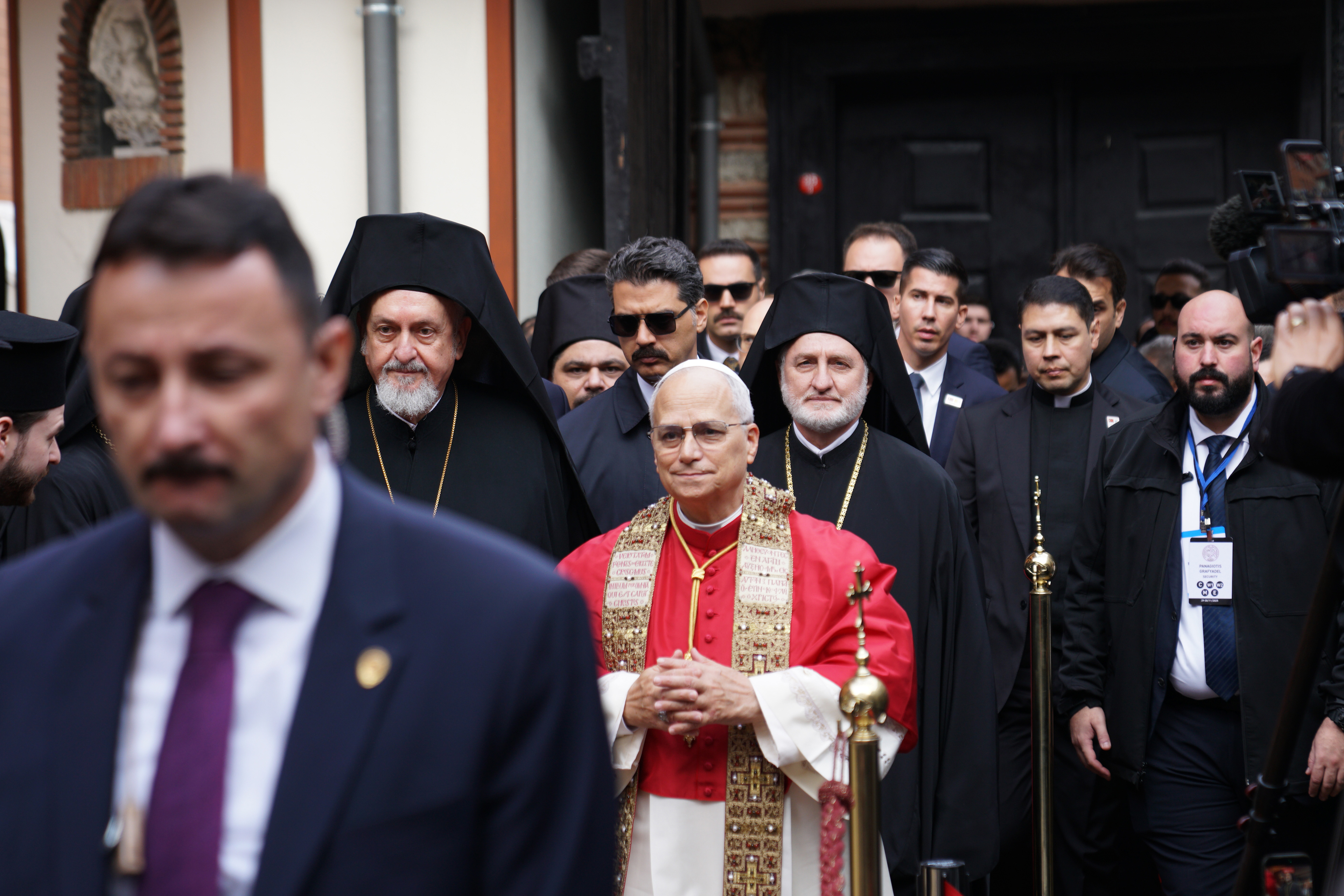 Pope Leo XIV is accompanied by Metropolitan Bishop Emmanuel (L) and Archbishop Elpidophoros of America (R) arrives at the Ecumenical Patriarchate, during his first apostolic journey, in Istanbul, Turkey, November 30, 2025.