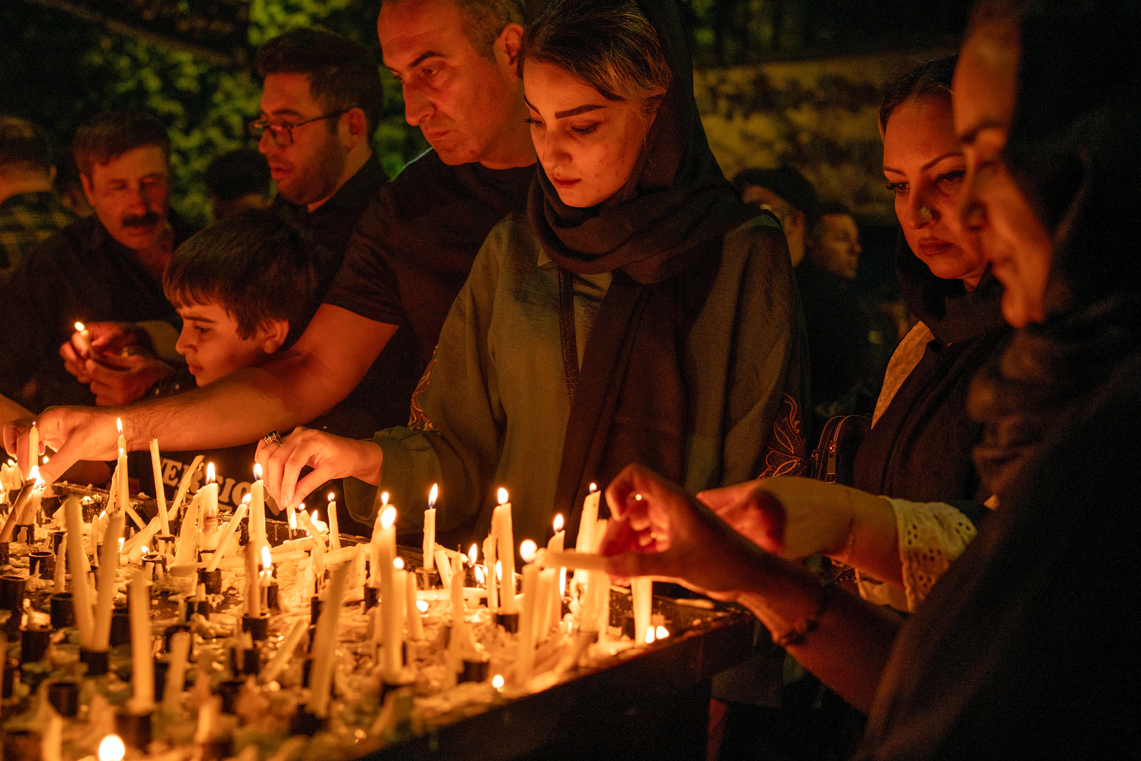 Shiite Muslims in Ardabil lights a candle to being a light for Imam Hussein on Ashura Day the 1384th anniversary of Imam Hussein's martyrdom. Shiite Muslims in black mourn in squares and mosques on Ashura, the teenth day of Muharram.