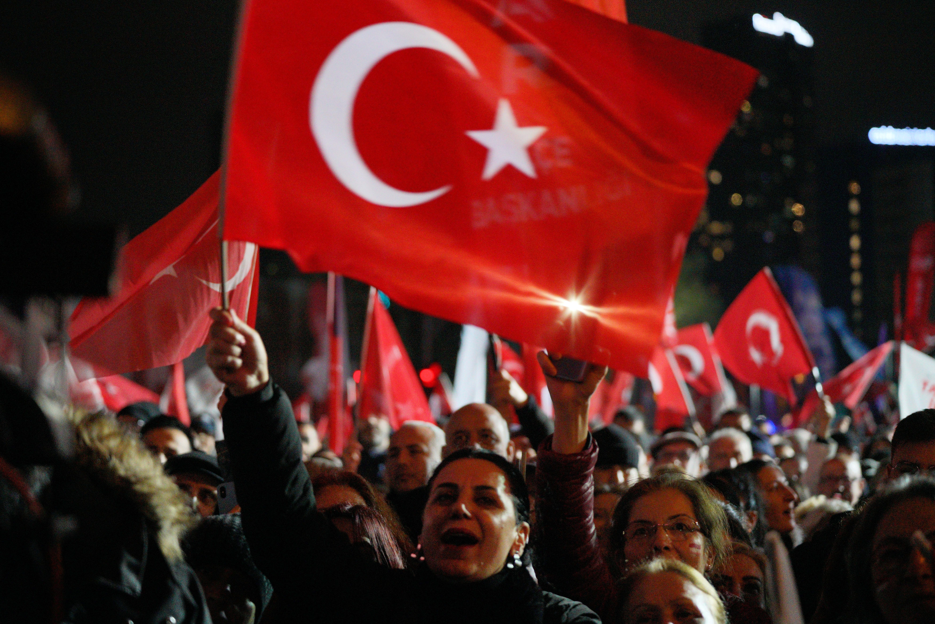 A person hold a Turkish flag during a rally to protest against the arrest of Istanbul Mayor Ekrem Imamoglu as part of a corruption investigation, in Istanbul on April 9, 2025.