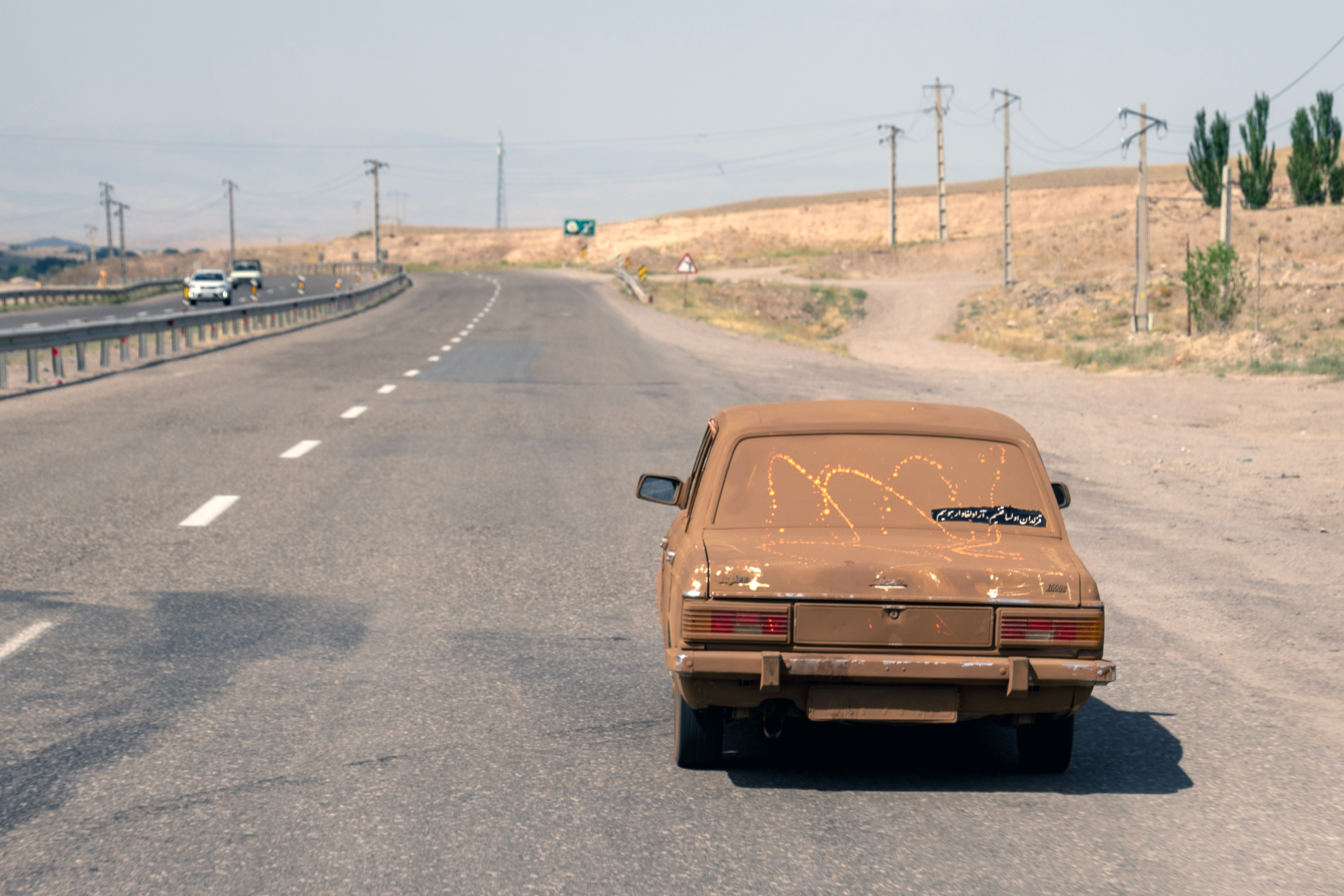 Image of a car covered in mud and earth in Bostanabad, Iran, on the day of Ashura, the 1384th anniversary of Imam Hussein's martyrdom. July 28, 2023.