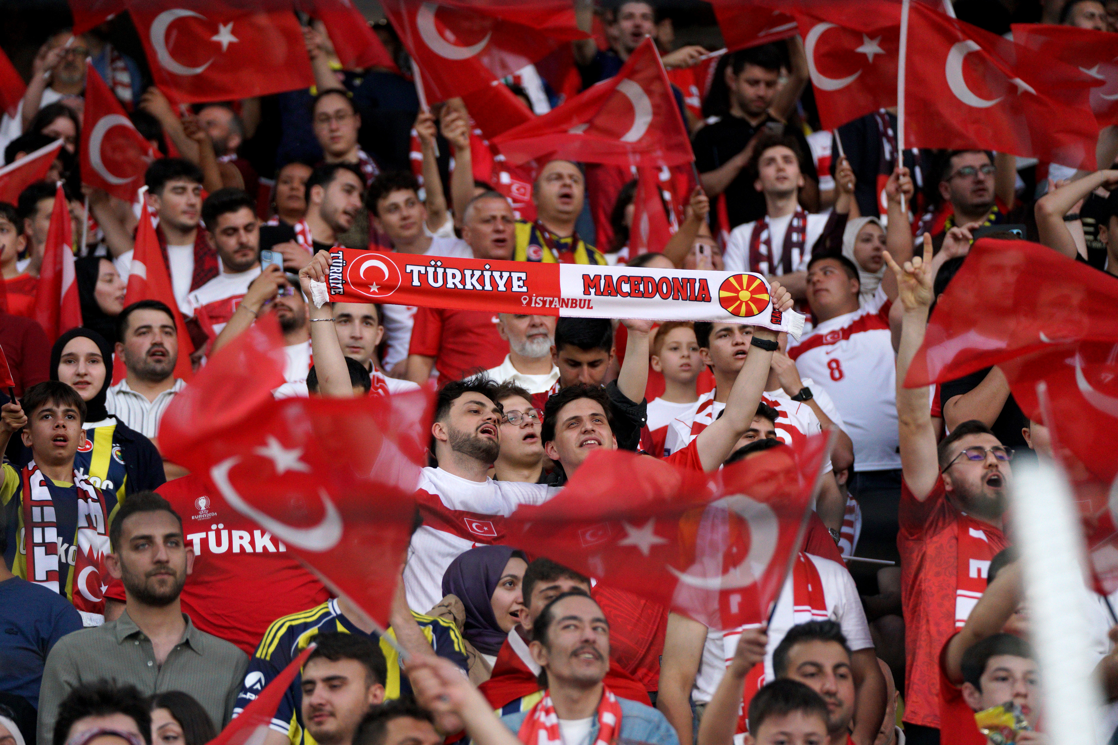 Turkish national team fans chant slogans and wave Turkish flags ahead of the Turkey-North Macedonia match, to be played at Fenerbahce Sukru Saracoglu Stadium in Istanbul on June 1, 2026, as part of the preparations for the 2026 FIFA World Cup.